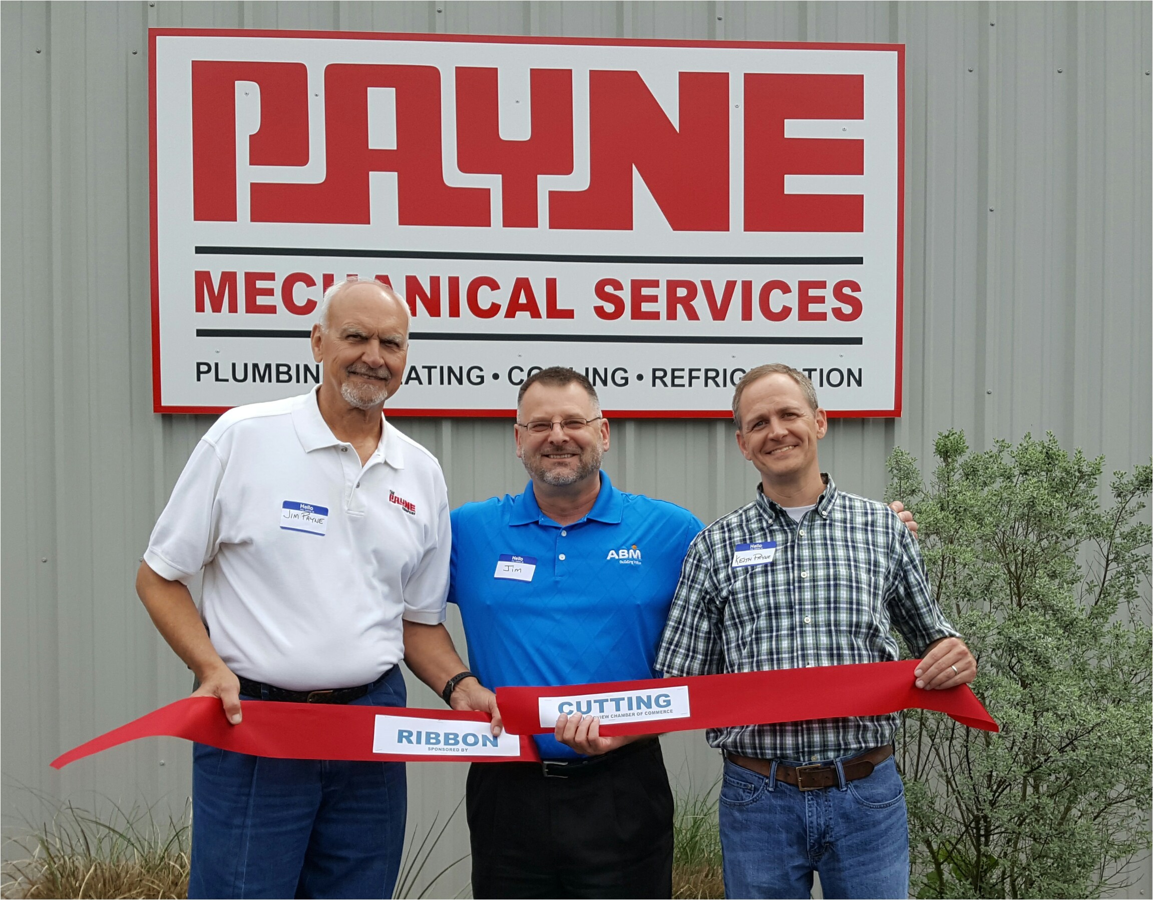 payne mechanical services principals jim payne left and keith payne right celebrate the opening of the company s new location in longview texas