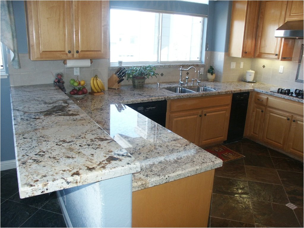 cozy alaskan white granite for modern countertop material ideas with oak kitchen cabinets for traditional kitchen design