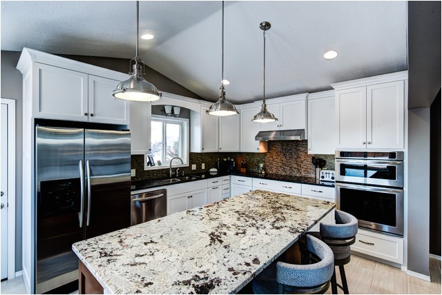 painted cabinets with alaska white granite on the island transitional kitchen minneapolis