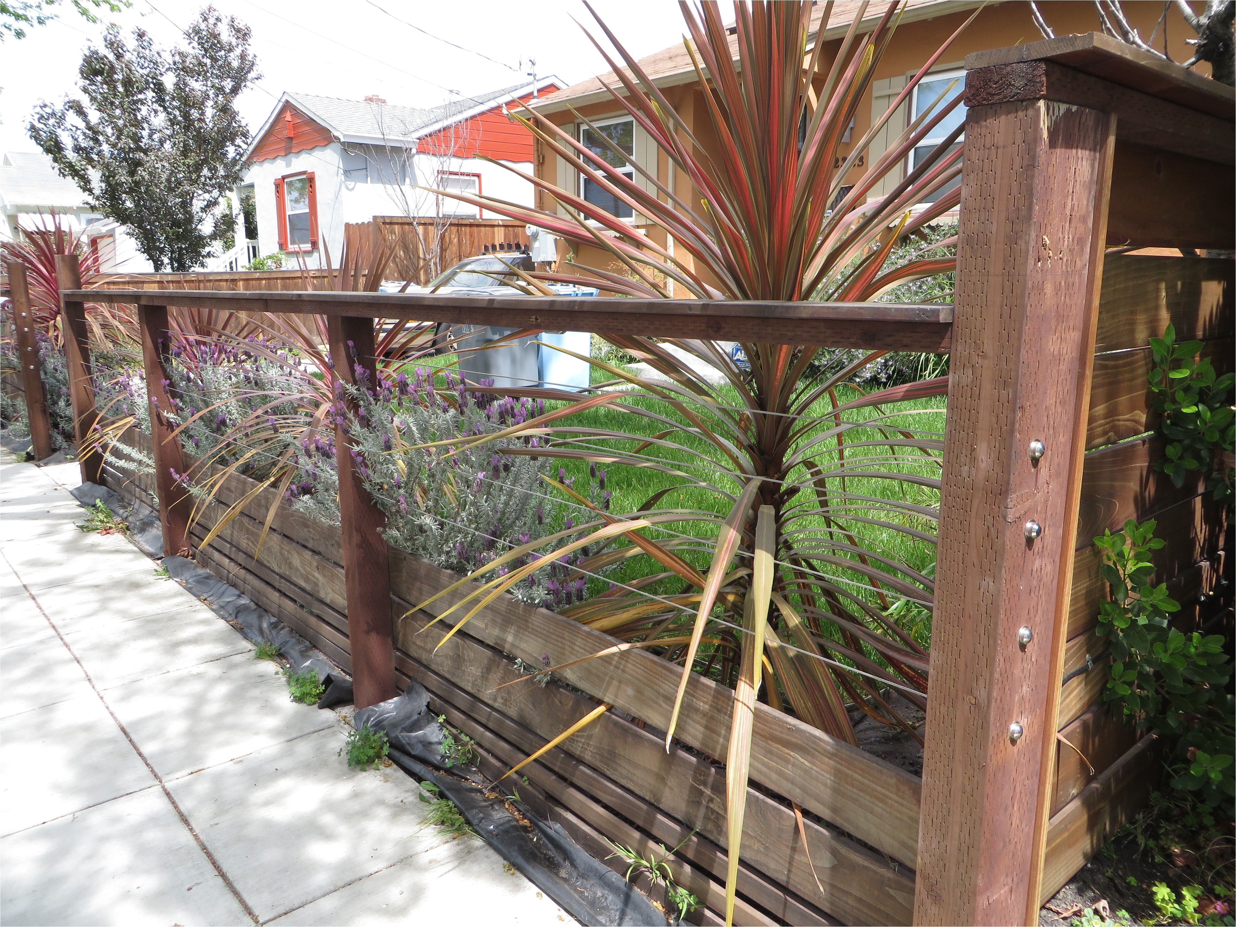 modern low fence with wood at bottom horizontal wires and nice metal details
