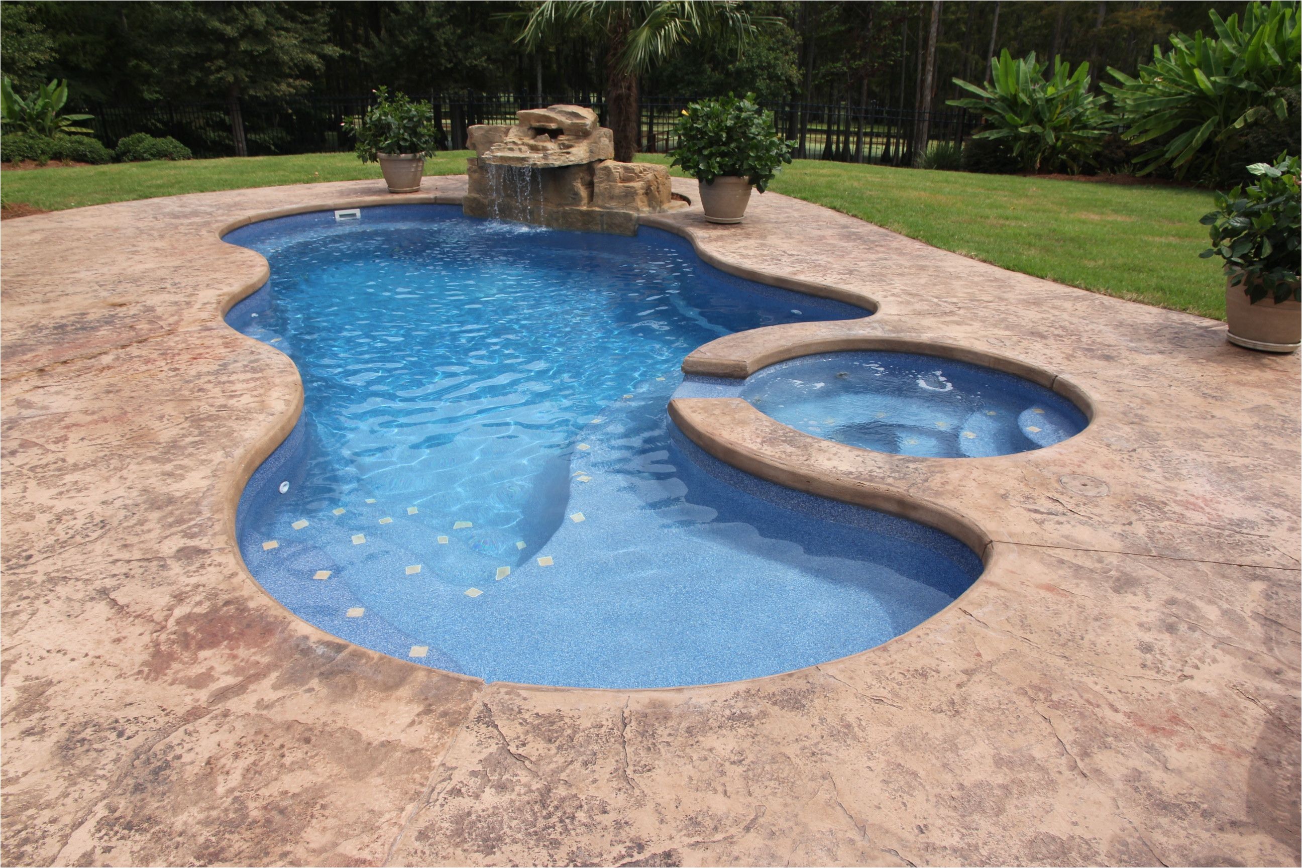 saltwater fiberglass swimming pool by dolphin pools of west monroe viking pools trilogy pools spa with spillover with rico rock waterfall pentair ic40