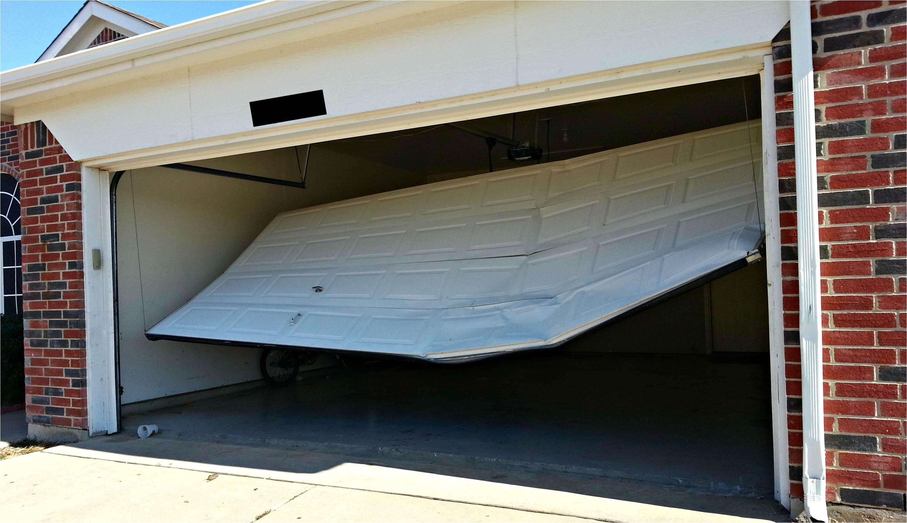 broken garage door in navarre