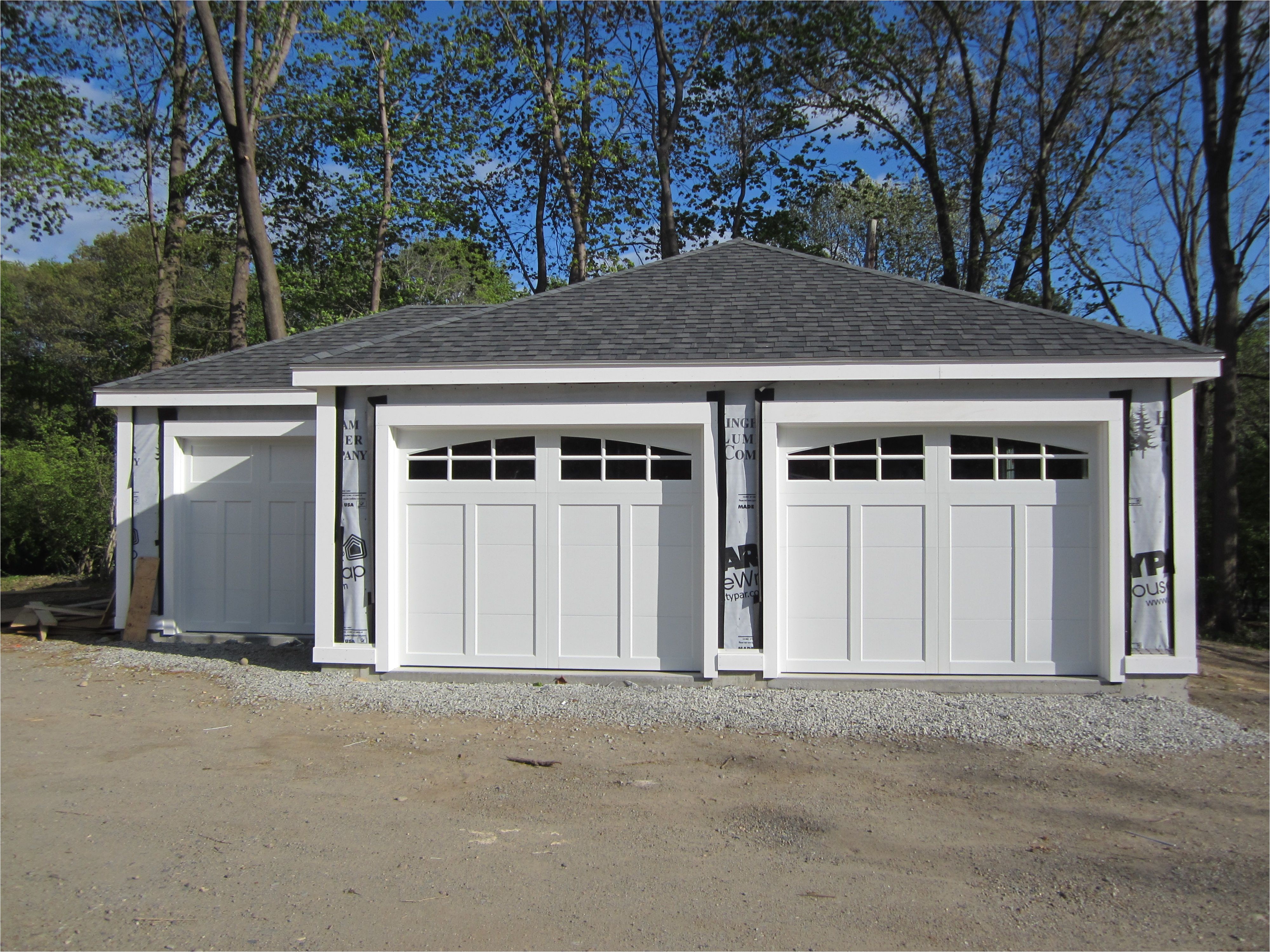 haas american tradition model 921 steel carriage house style garage doors in white with arch 6 pane glass installed by mortland overhead door