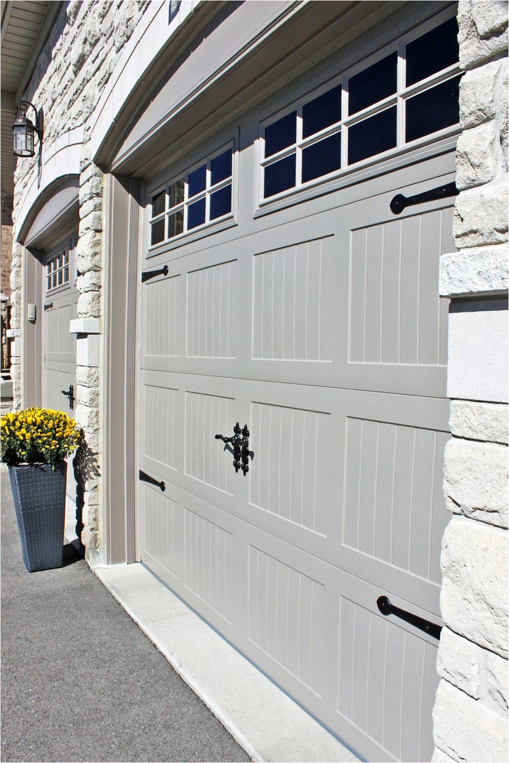 i never thought i would be so excited over a pair of overhead garage doors our old wood garage doors which came with the house were falling