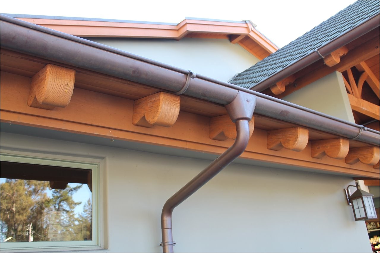 half round copper gutter w star outlet cast brass hanger