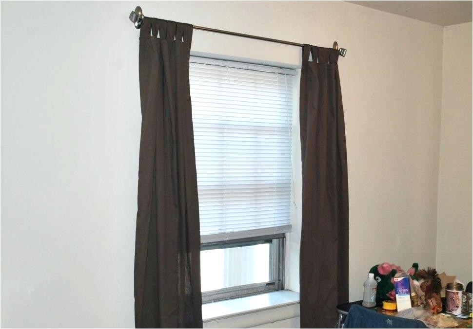 how to hang curtains over vertical blinds without drilling