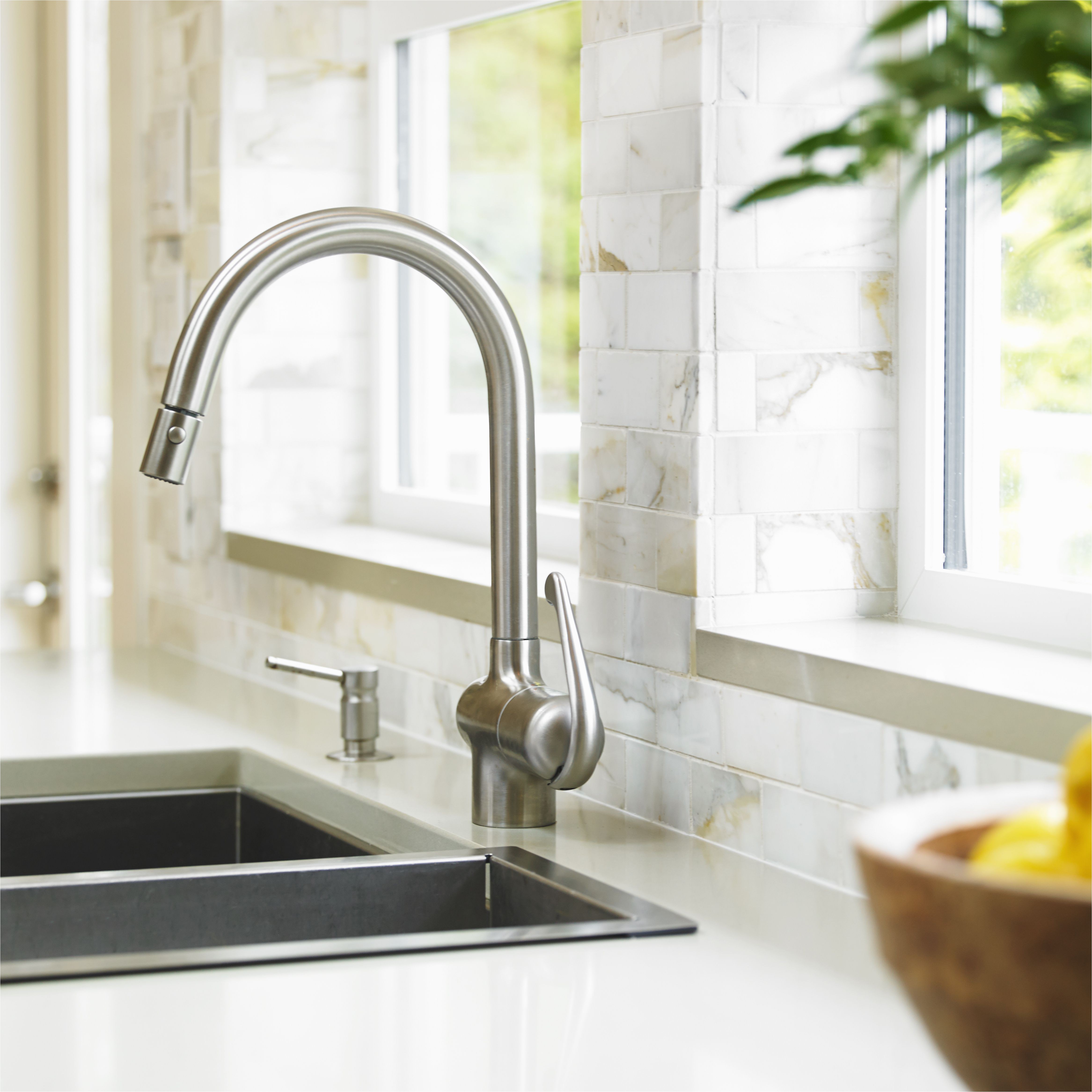 close up of stainless steel kitchen faucet with marble subway backsplash 540781705 57a397b03df78cf45940f722 jpg