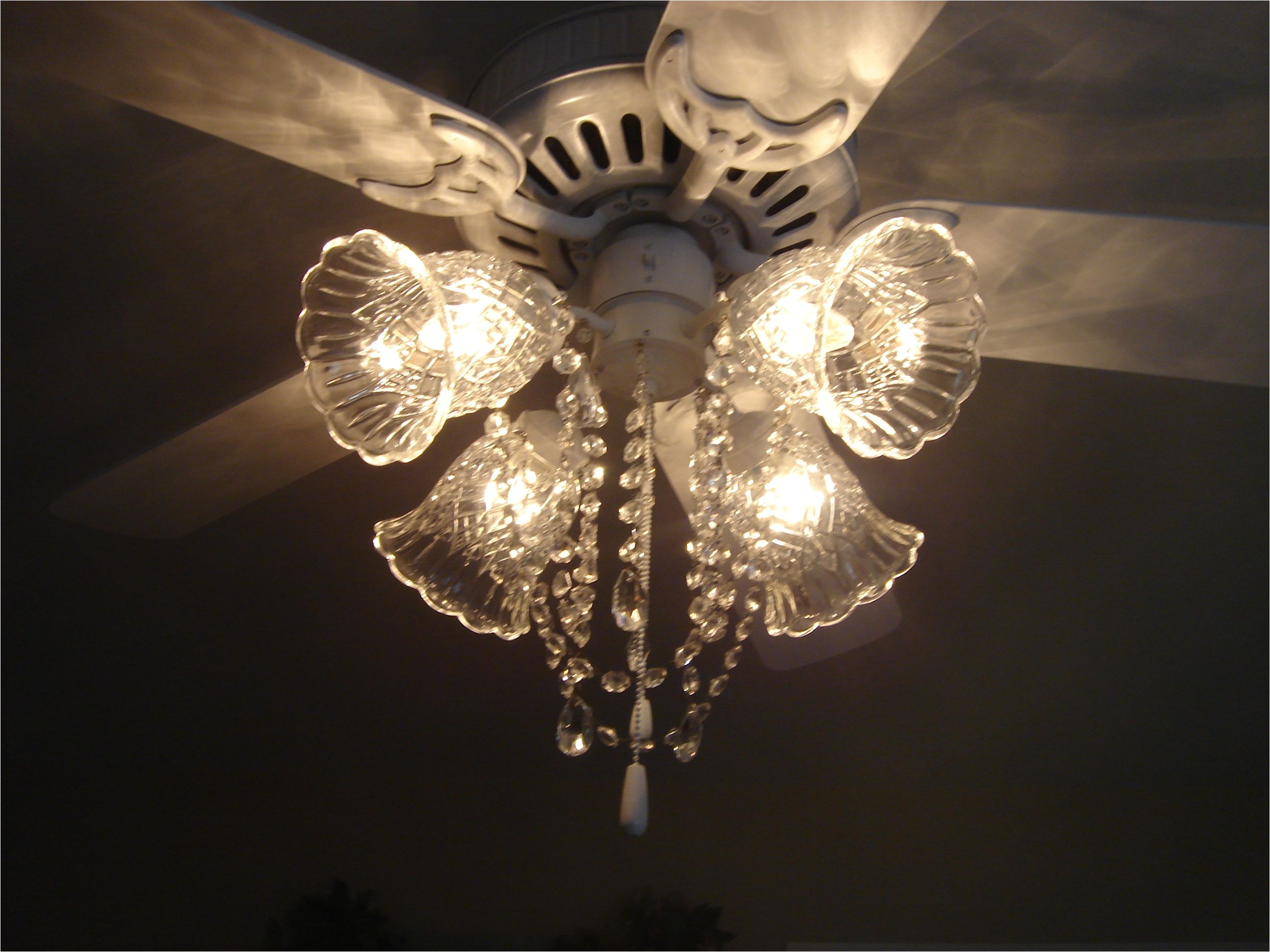ceiling fan after picture painted white and made into a fan chandelier added