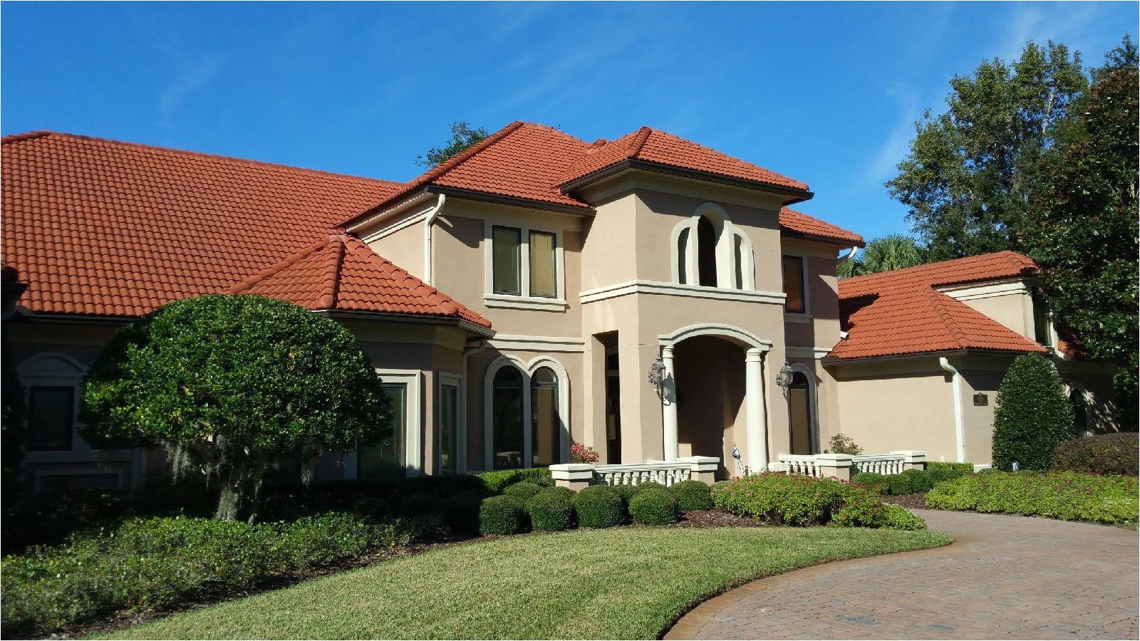 7 inch seamless gutters installed on this elegant stucco home