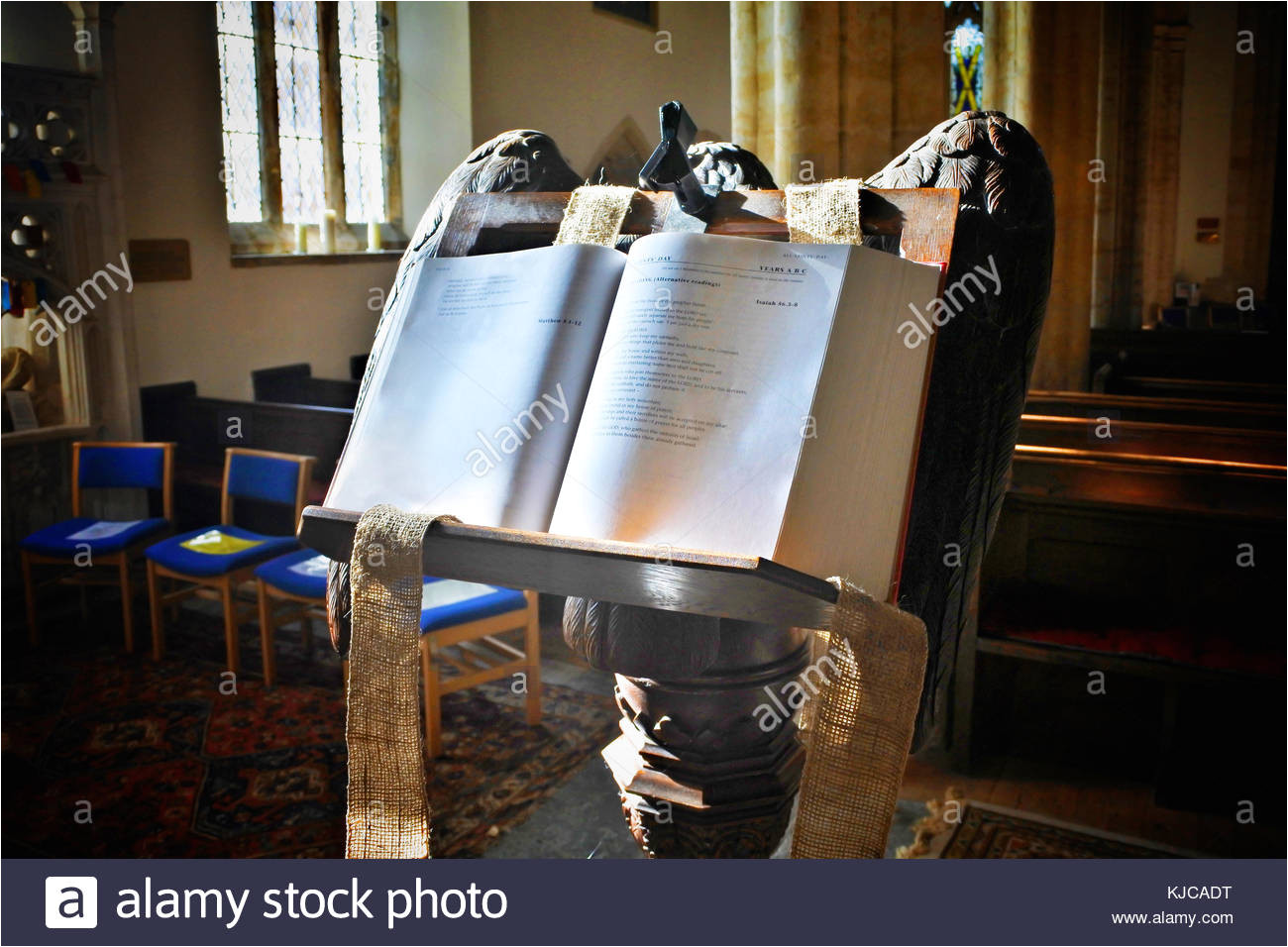 a holy bible open resting on the lectern at netherbury parish church dorset