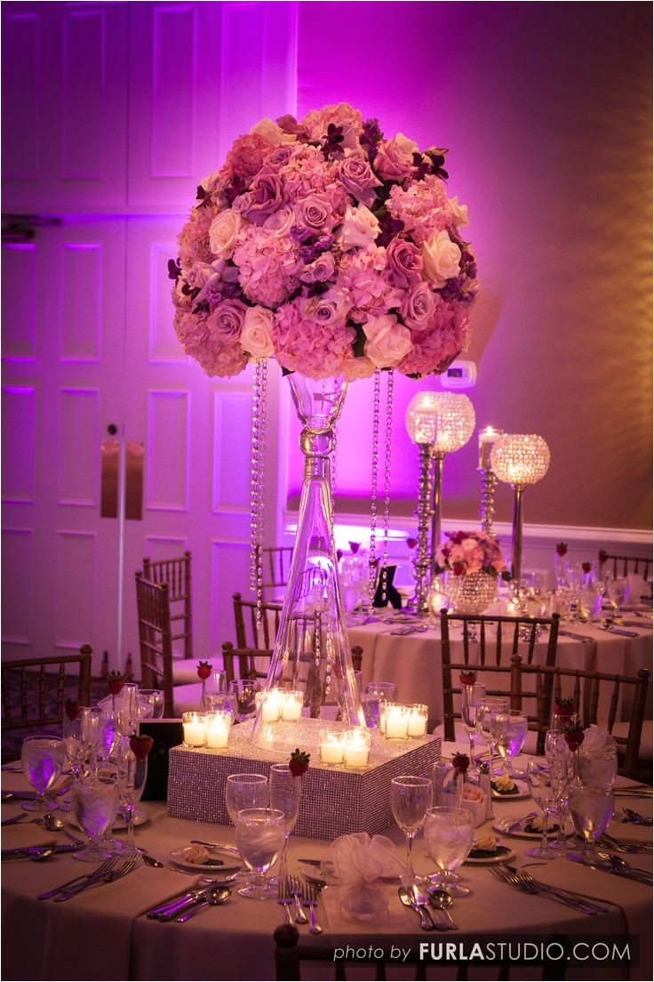 one of our most popular table designs large high centerpiece atop of a tulip vase