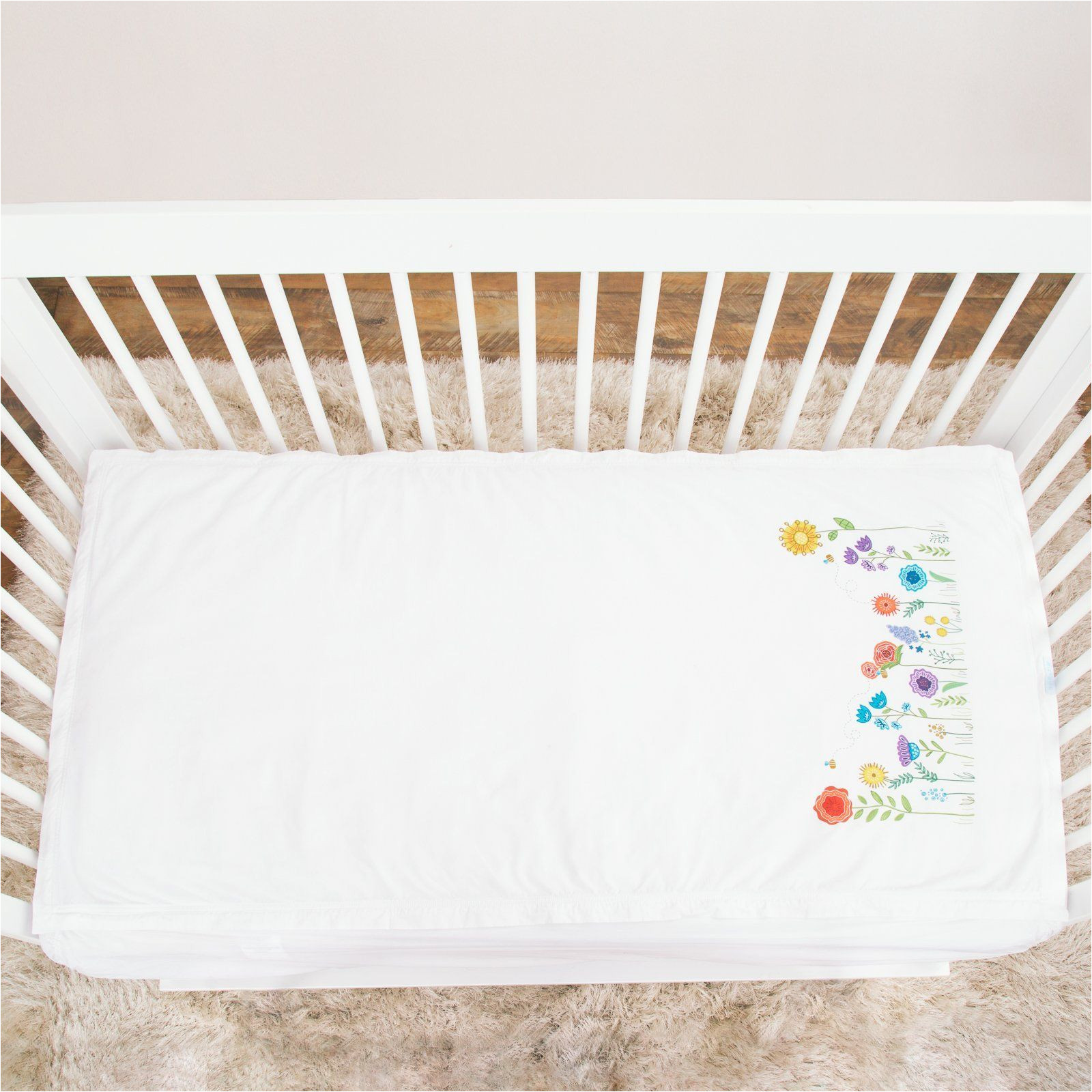 basic crib starter pack in white includes 1 wraparound base in white 1 cotton zip on sheet with sprouting garden print