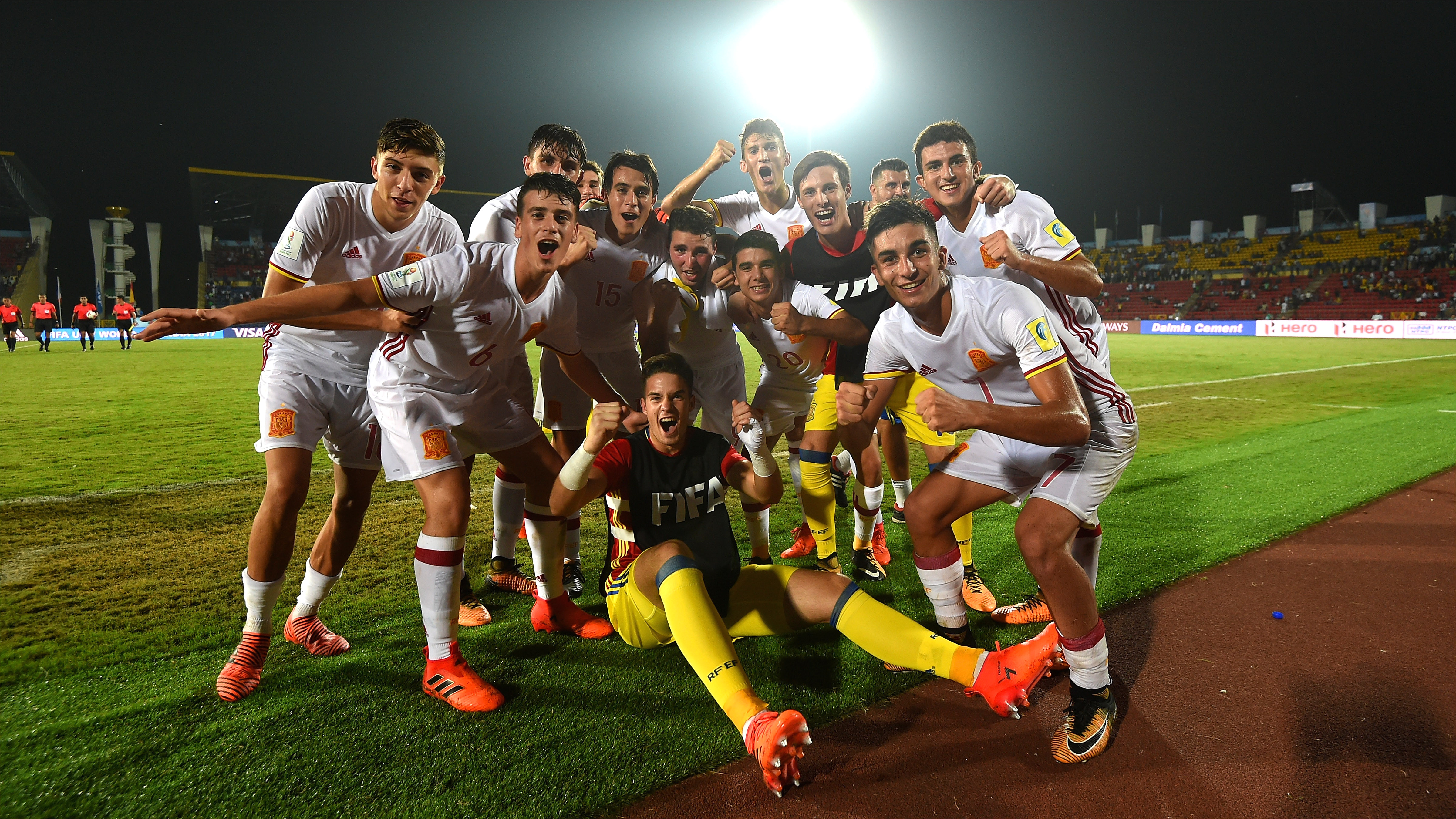 players of spain celebrate beating france