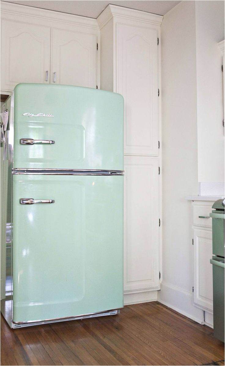 ballisty thelen this fridge is called big chill fridge and this kitchen is adorable love the unfinished wood shelves for glass and serving ware