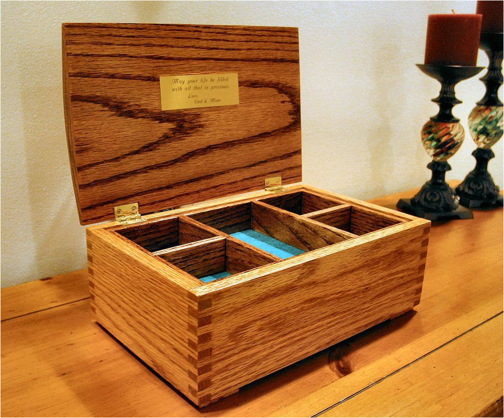 an open jewelry box on a dresser