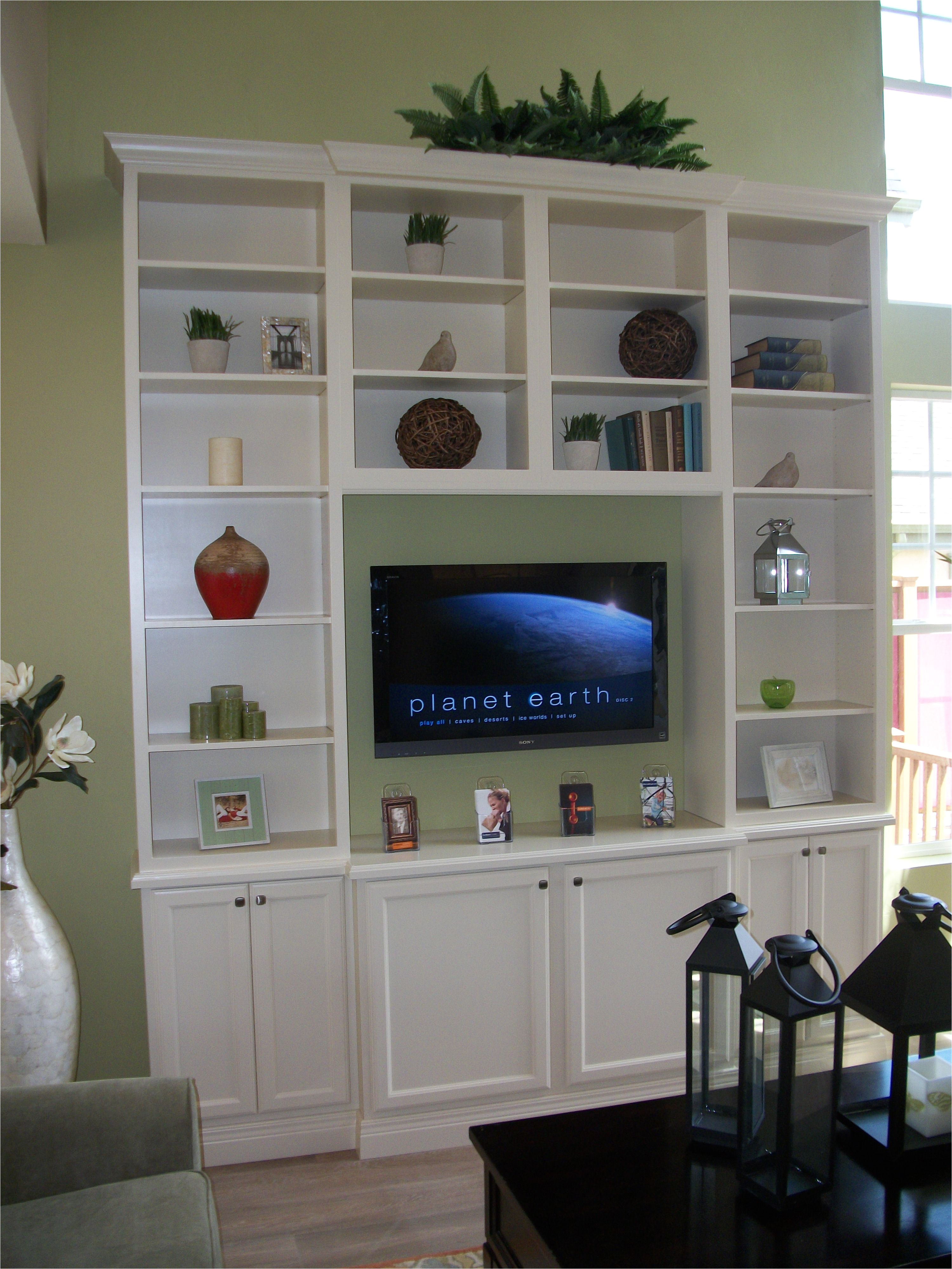 diy tall entertainment center with stock cabinets and bookshelves