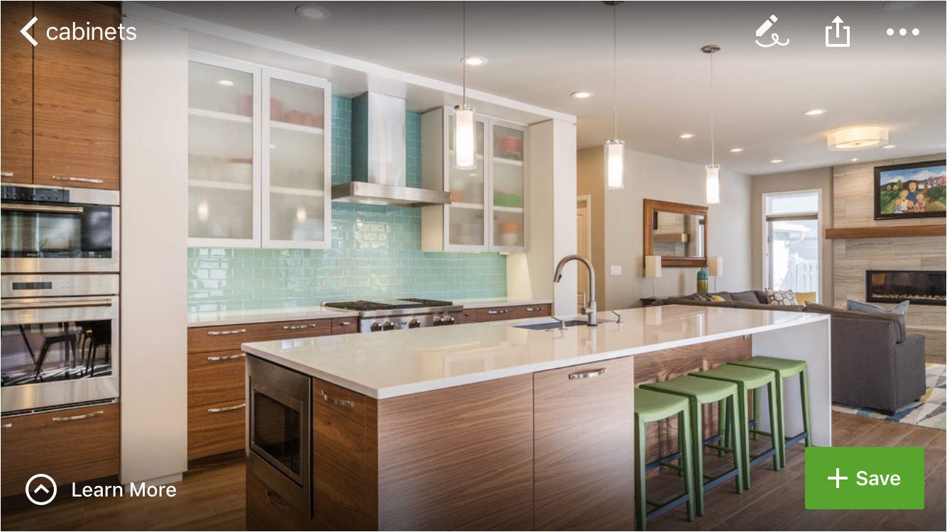 3 toned kitchen white upper cabinets with semi transparent doors glass tile backsplash in cool color tone warm wood medium walnut in base cabinets 2