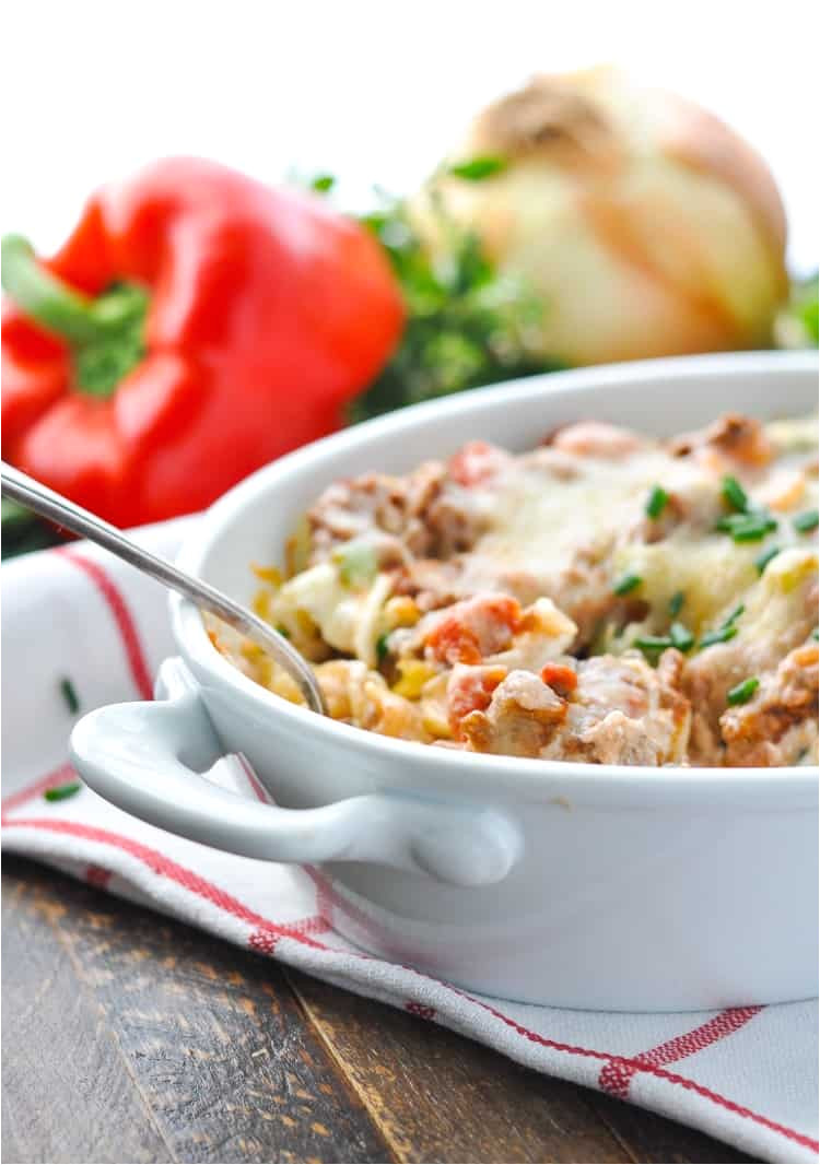 a side shot of an amish hamburger casserole in a white dish