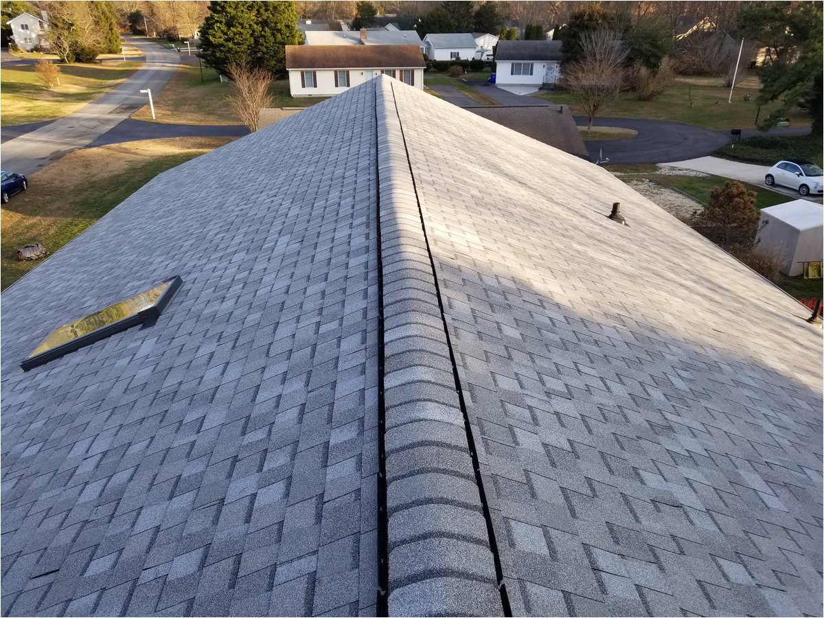 with a certainteed cobblestone gray landmark shingle this roof replacement required the removal of two layers of shingles and re flashing the chimney