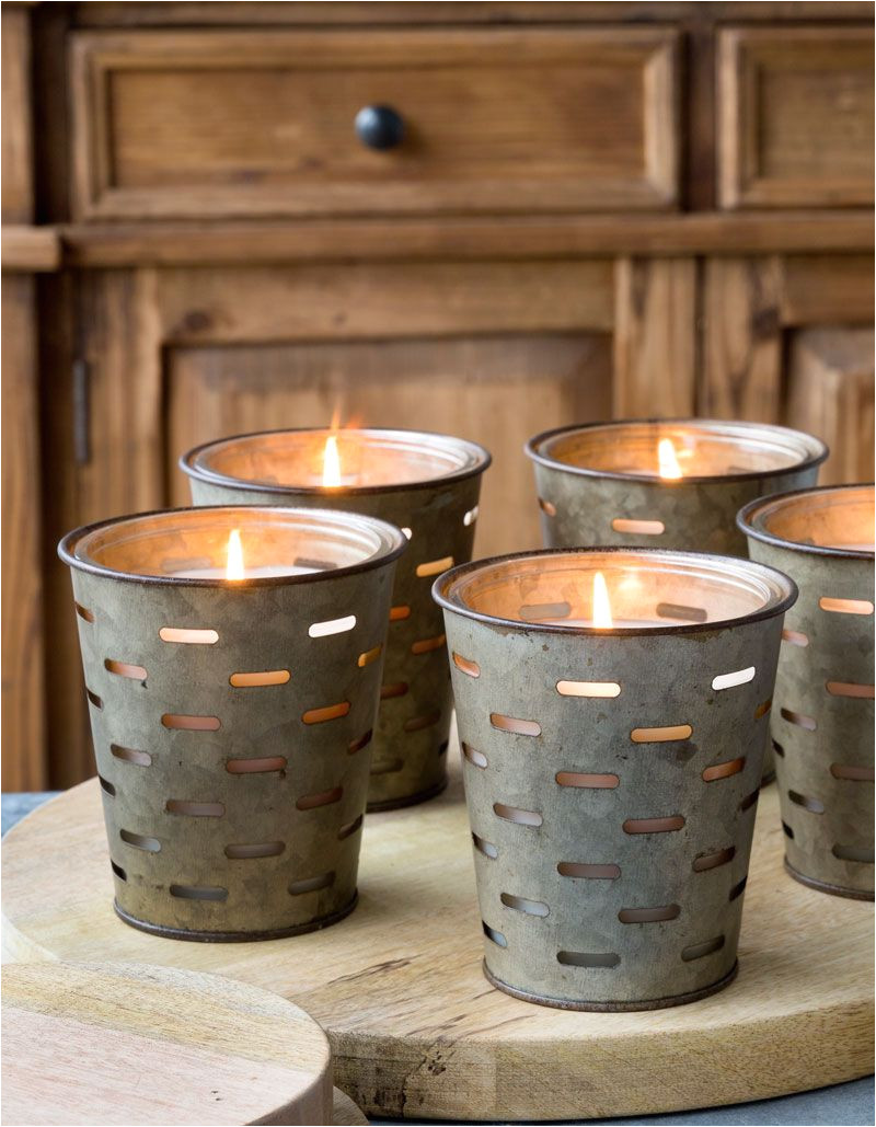 metal olive bucket candles these have a glass sleeve so once the candle is burned down they can be reused with small pillar candles 25 each