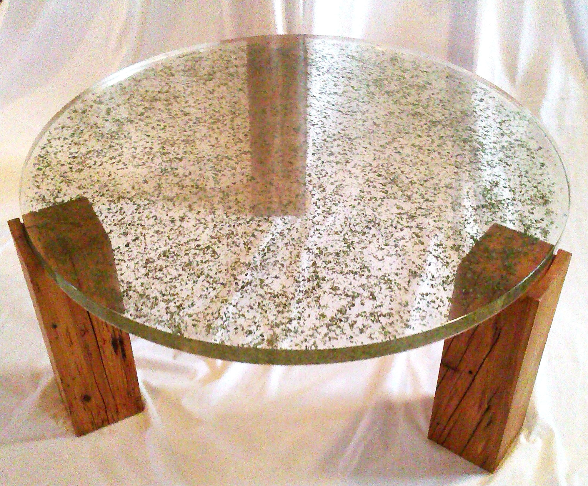 translucent resin table top with embedded crushed leaves by fogliart