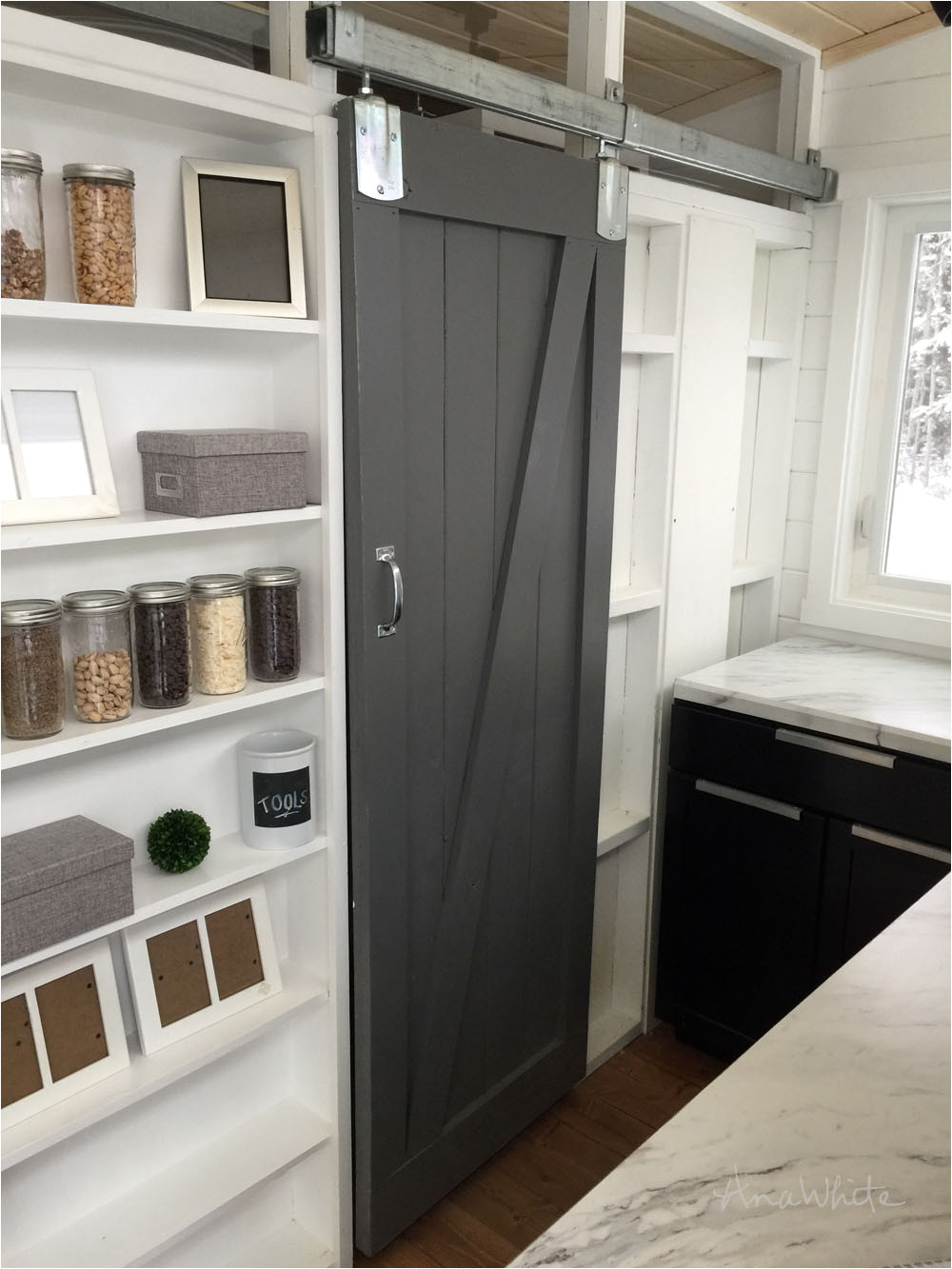 how we built a barn door for our tiny house