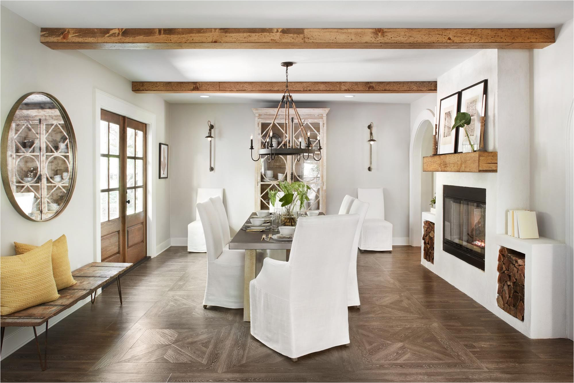 we mirrored the same wooden mantel as we used in the living room in the dining room another fun detail of this fireplace is that these wood storage boxes