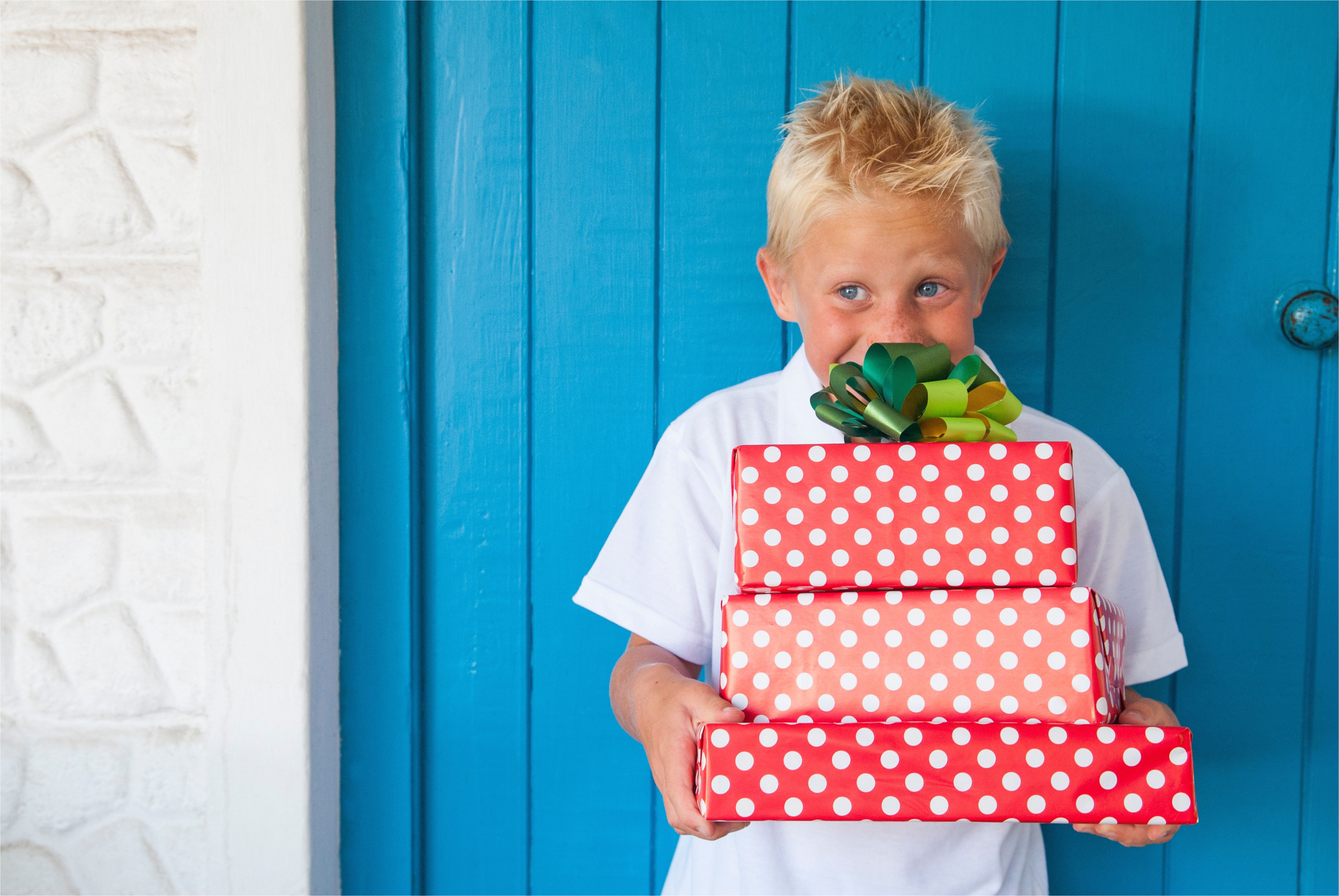 boy excited at gifts 452413433 5af5eddbeb97de003db29cbc jpg