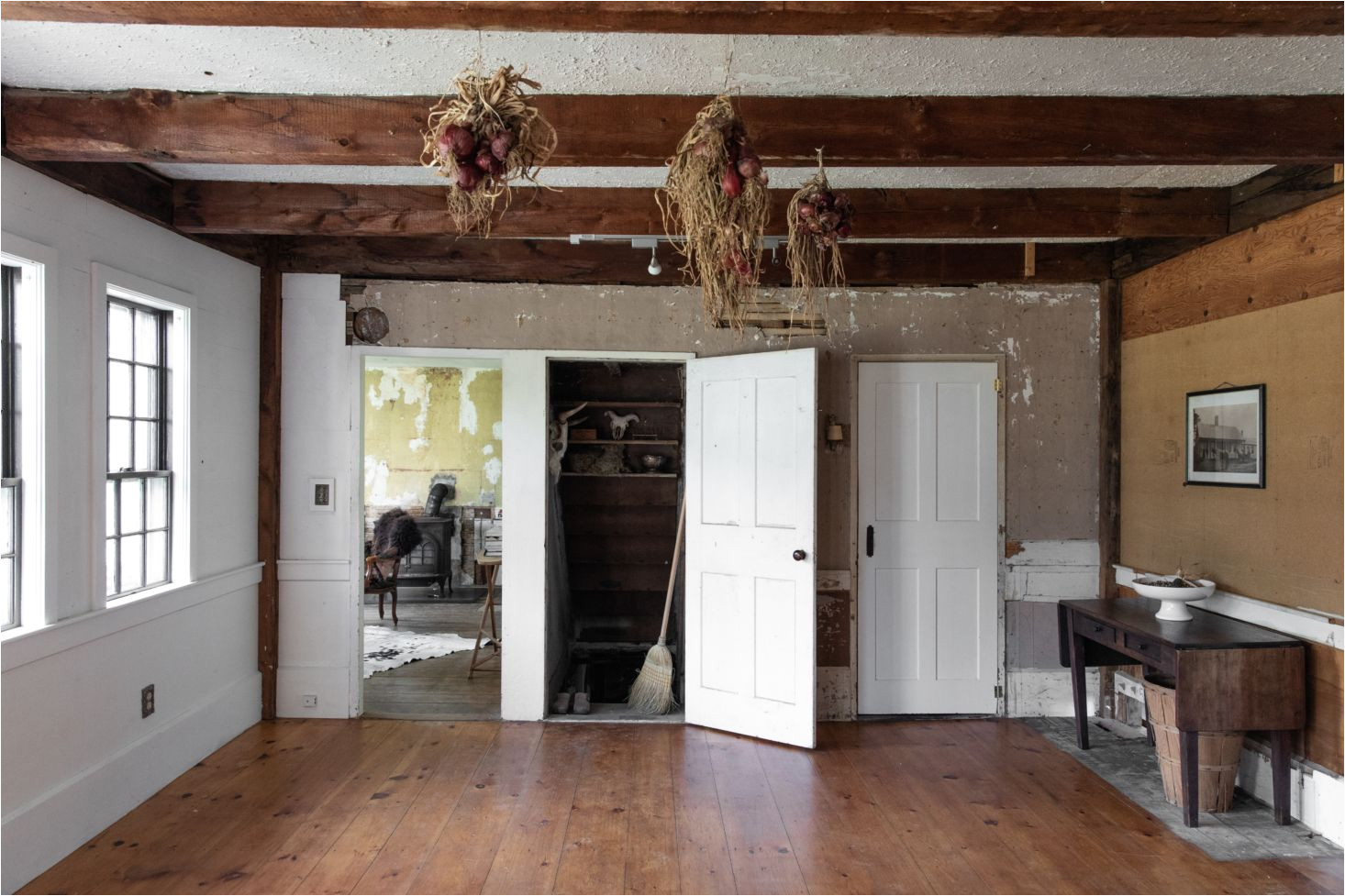 the front room with doors leading from left into the living room and bedrooms the cellar and the bath