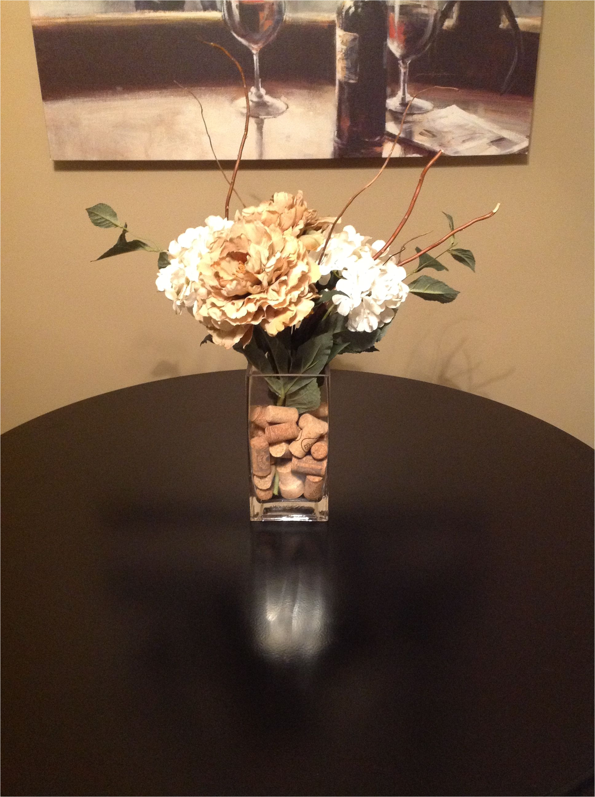 bought vase flowers and sticks from hobby lobby cut flowers to fit vase rubber band and bundle together at bottom and fill with wine corks from target