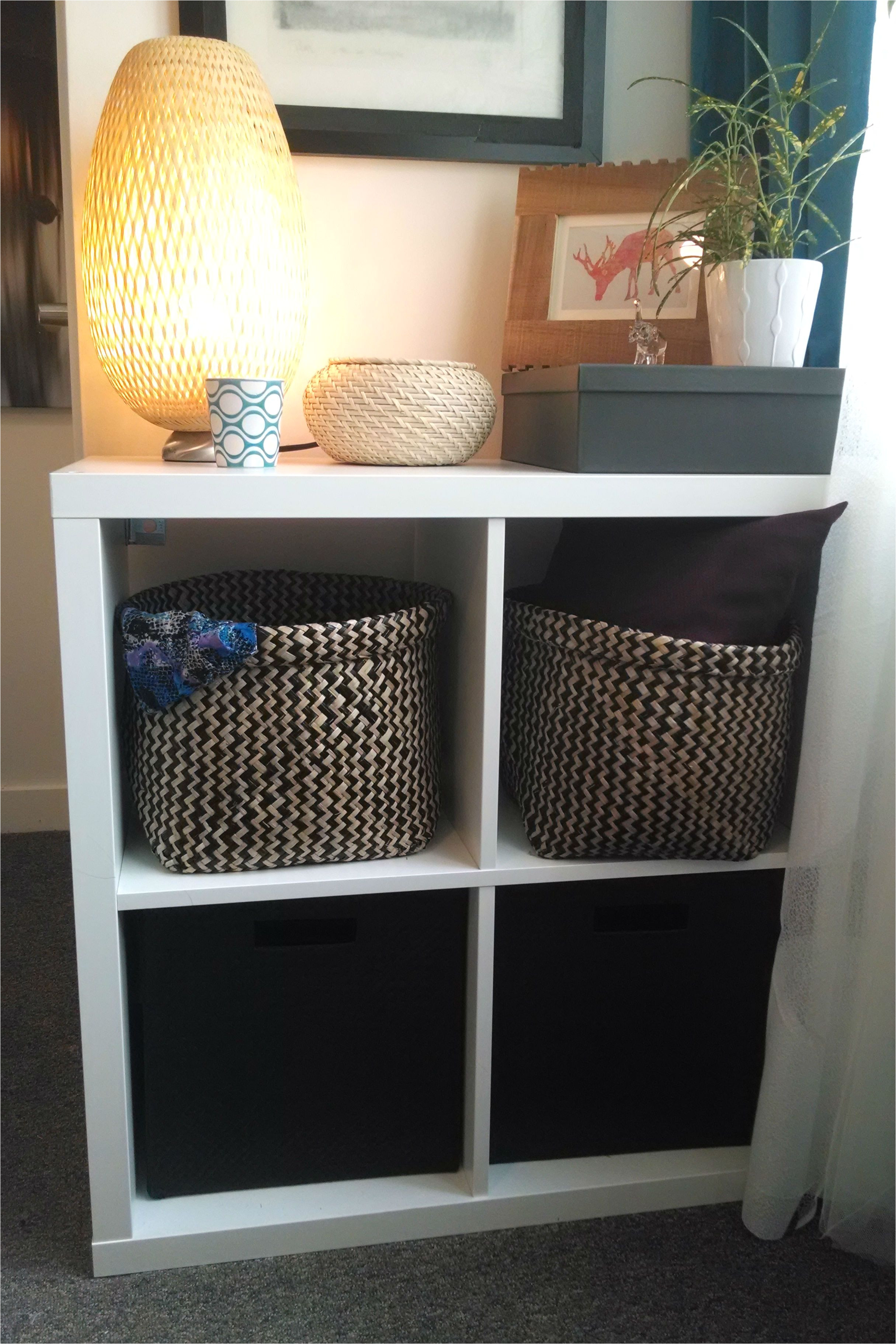 the kallax shelving unit plus some great textured baskets adds storage and pattern to this small space