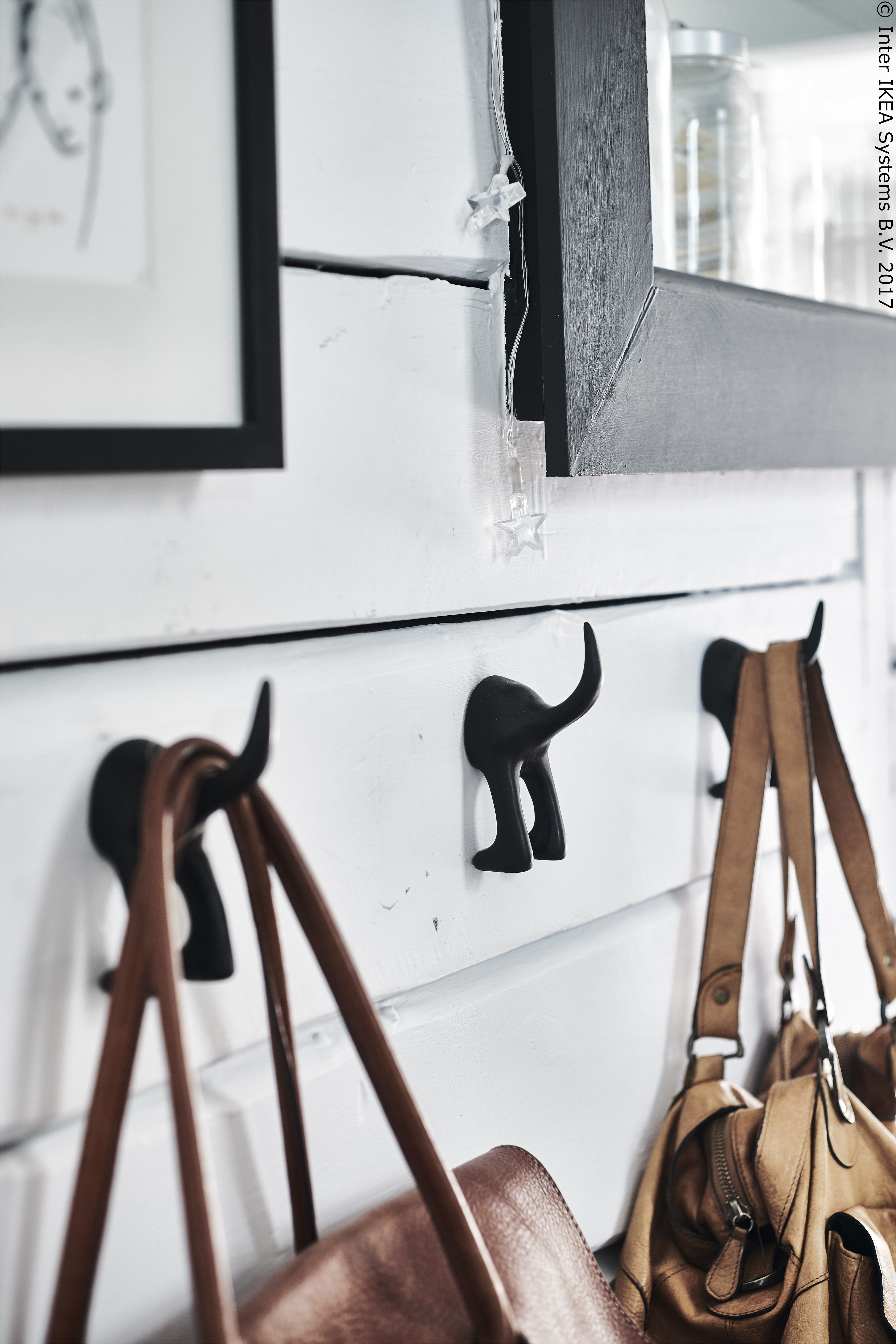 chopping boards hanging on a rail in a kitchen