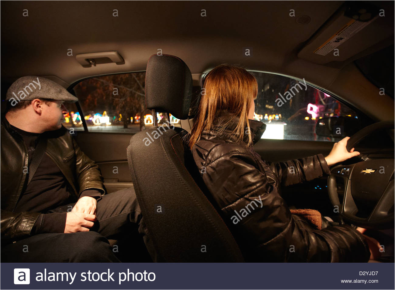 couple driving through illuminated enchanted forest attraction at night saskatoon saskatchewan canada stock image