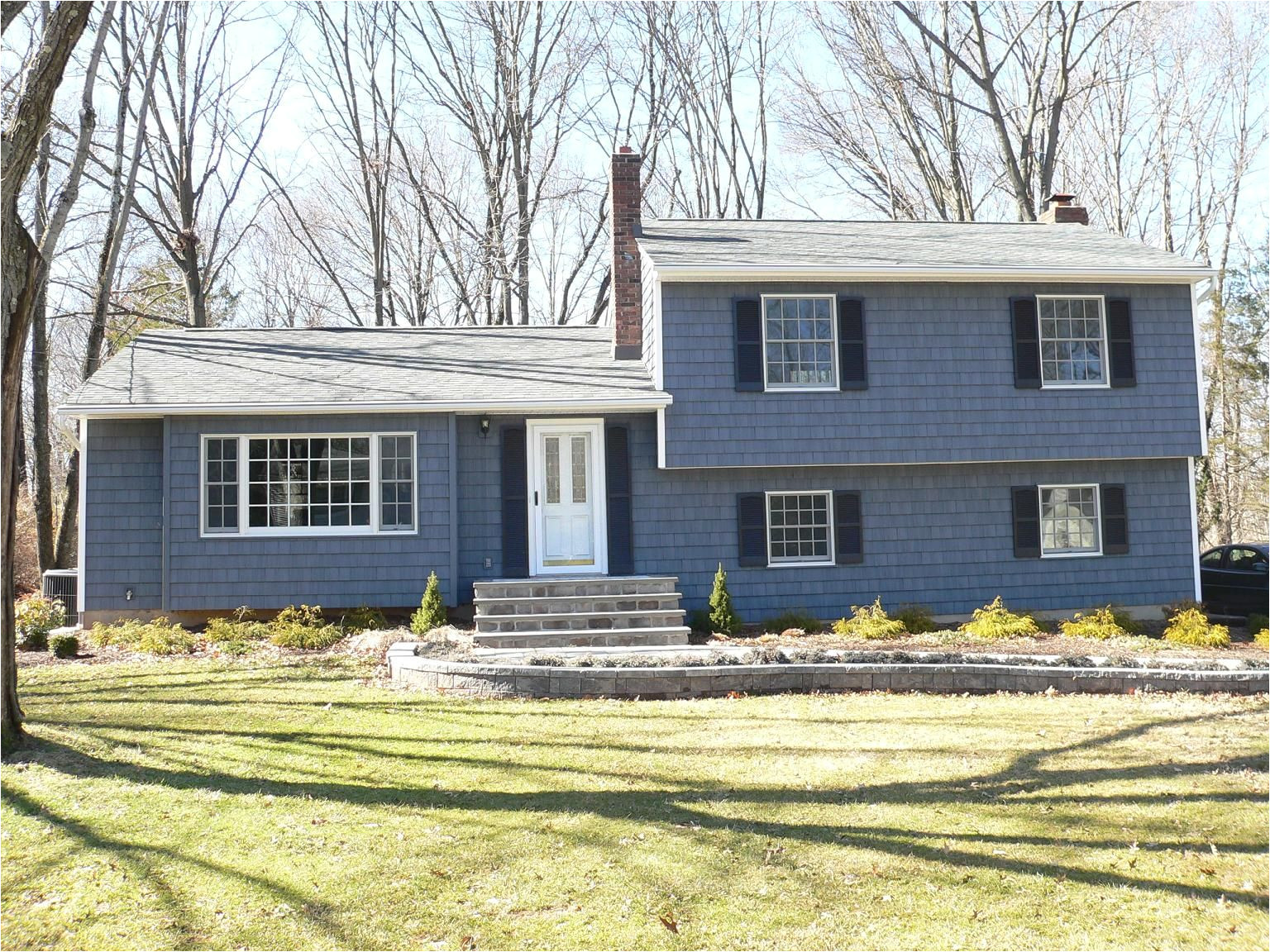 vinyl siding louvered black shutters thermatru smooth star front entry door new masonry porch bluestone treads cultured stone risers concrete slab