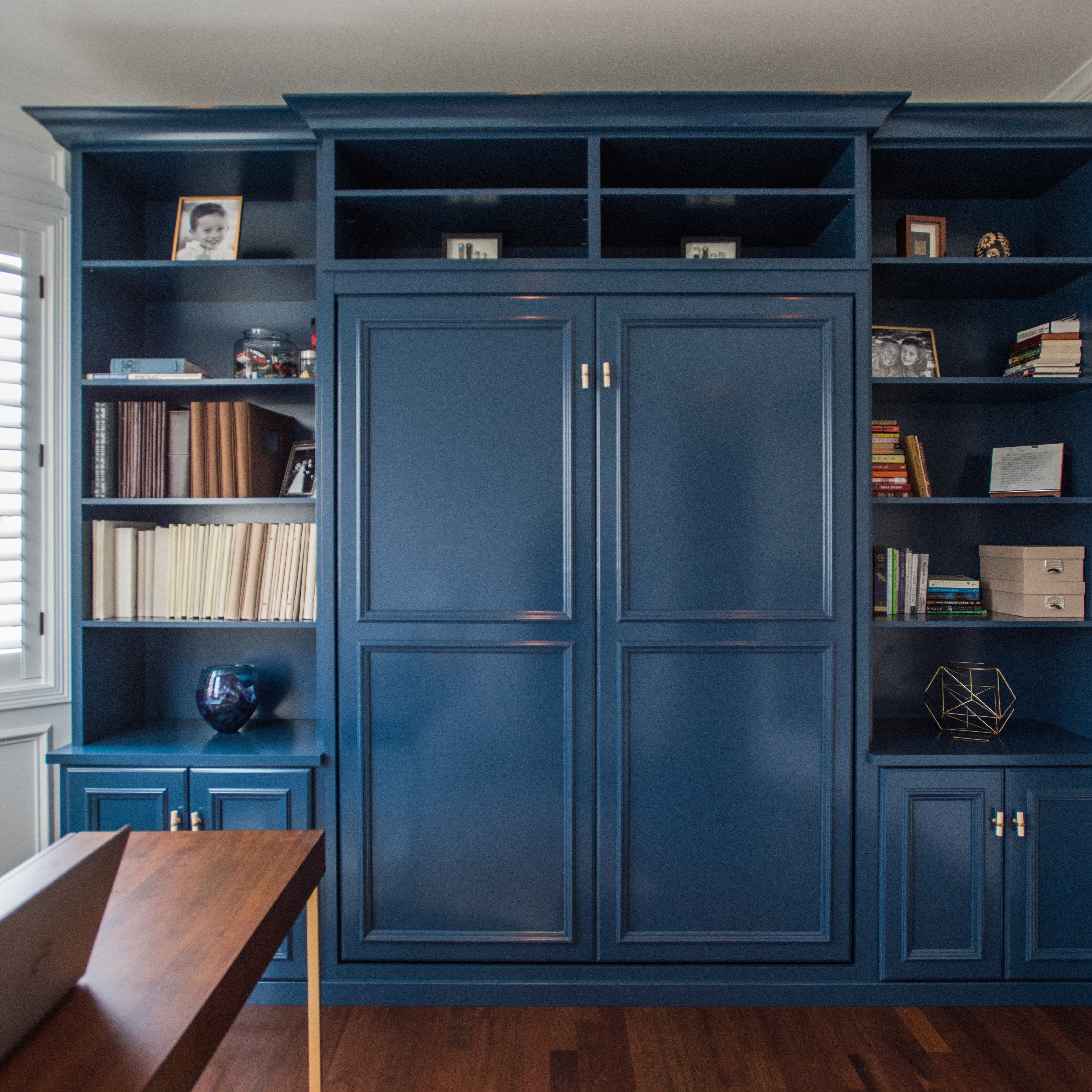 denver co library with custom designed book shelf with hidden queen murphy bed designed by maureen fancher closet factory colorado
