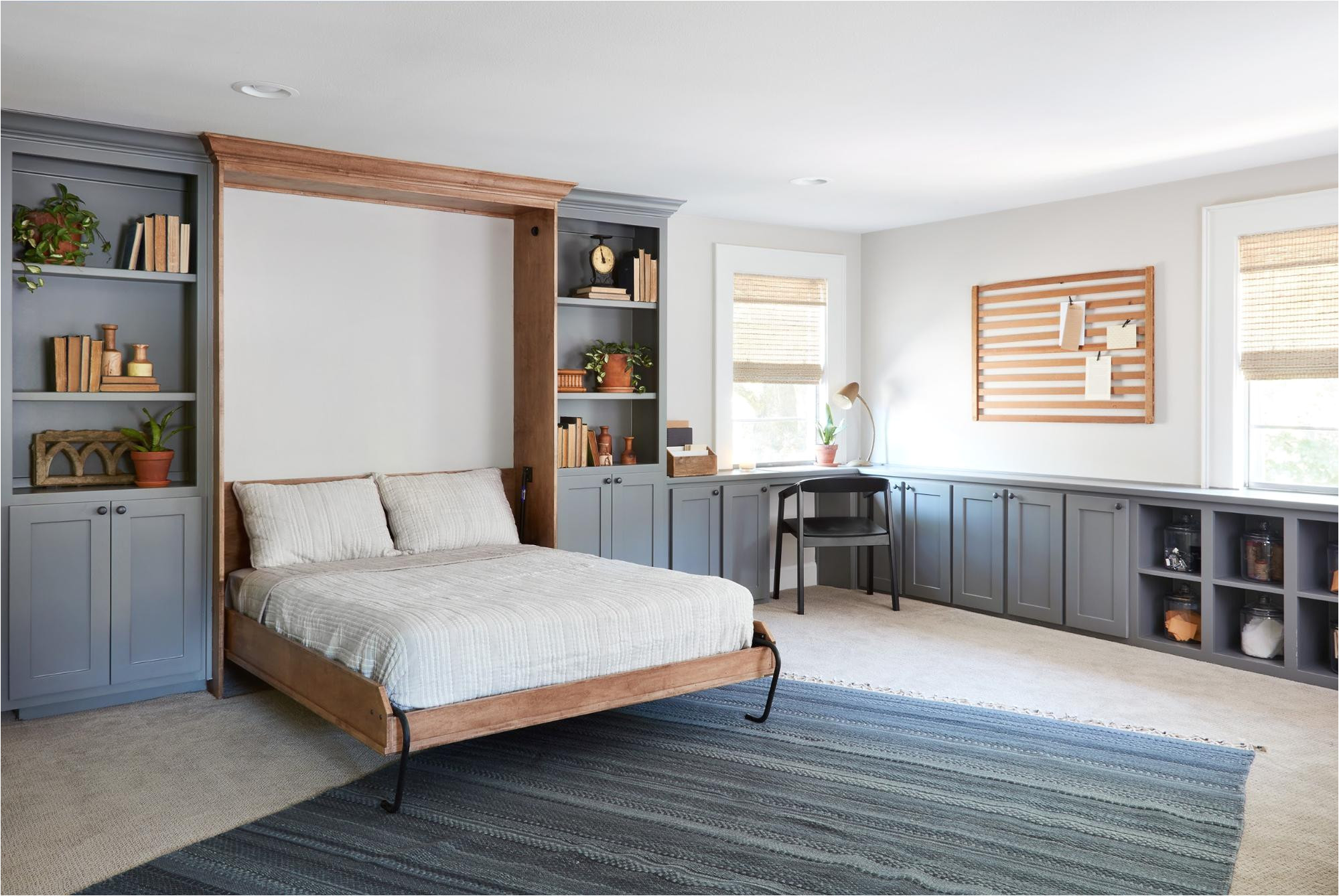 our solution for converting this space to a guest room was to incorporate a murphy bed since this room is in an upstairs loft style area of the home