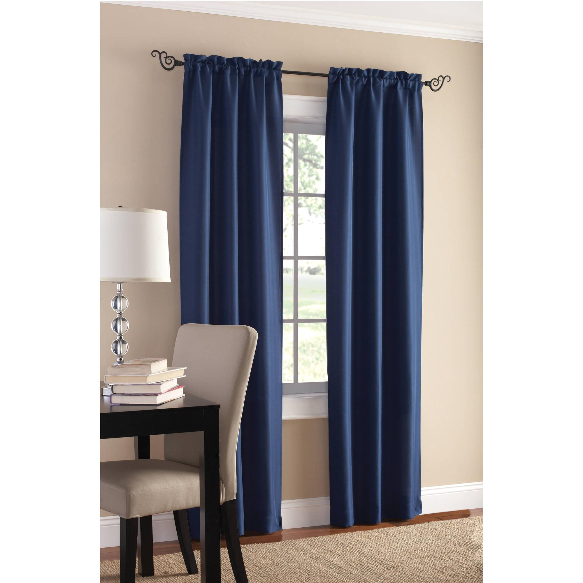 blue walmart blackout curtains with white baseboard and