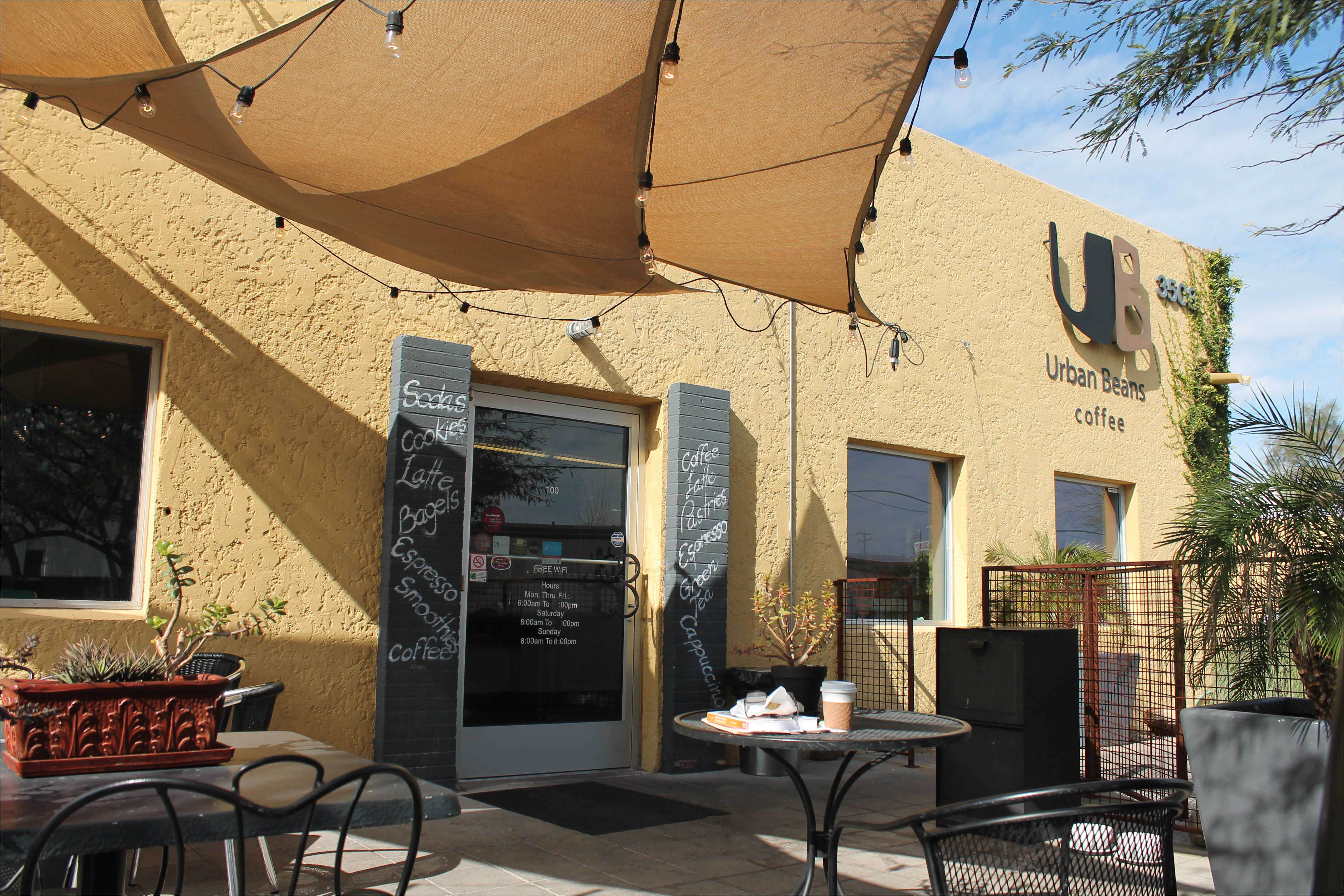 exterior view of urban beans phoenix az outdoor patio seating with tables and