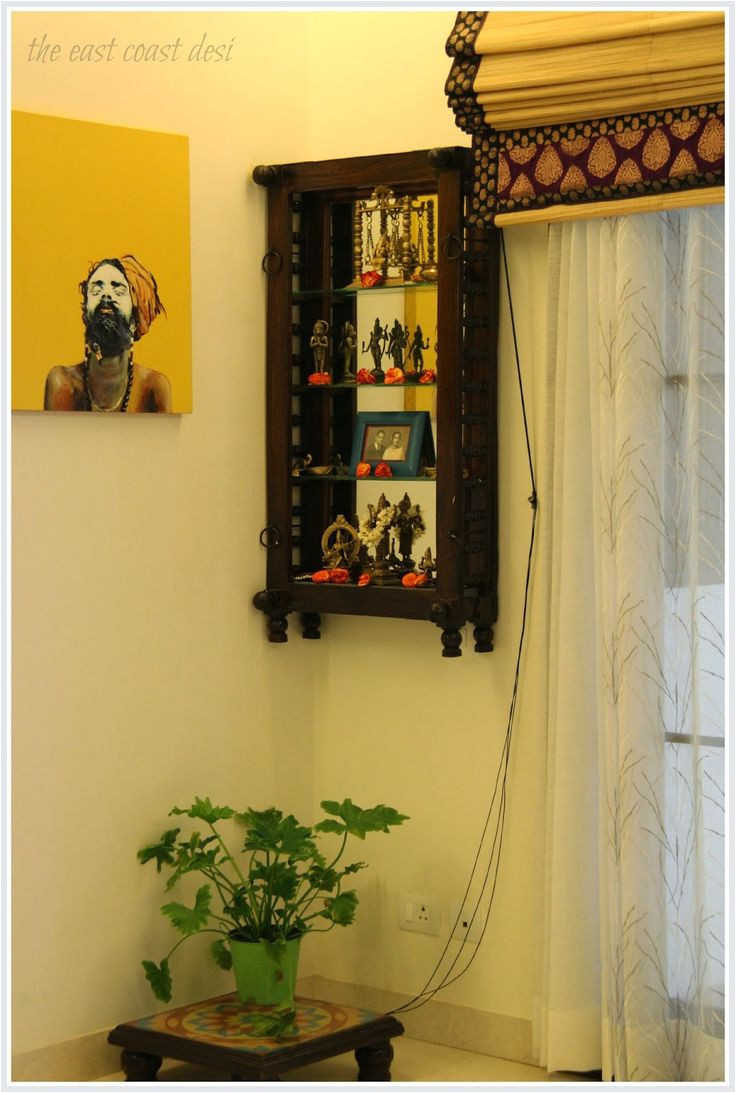 a section of the dining room has been dedicated as the pooja corner an antique