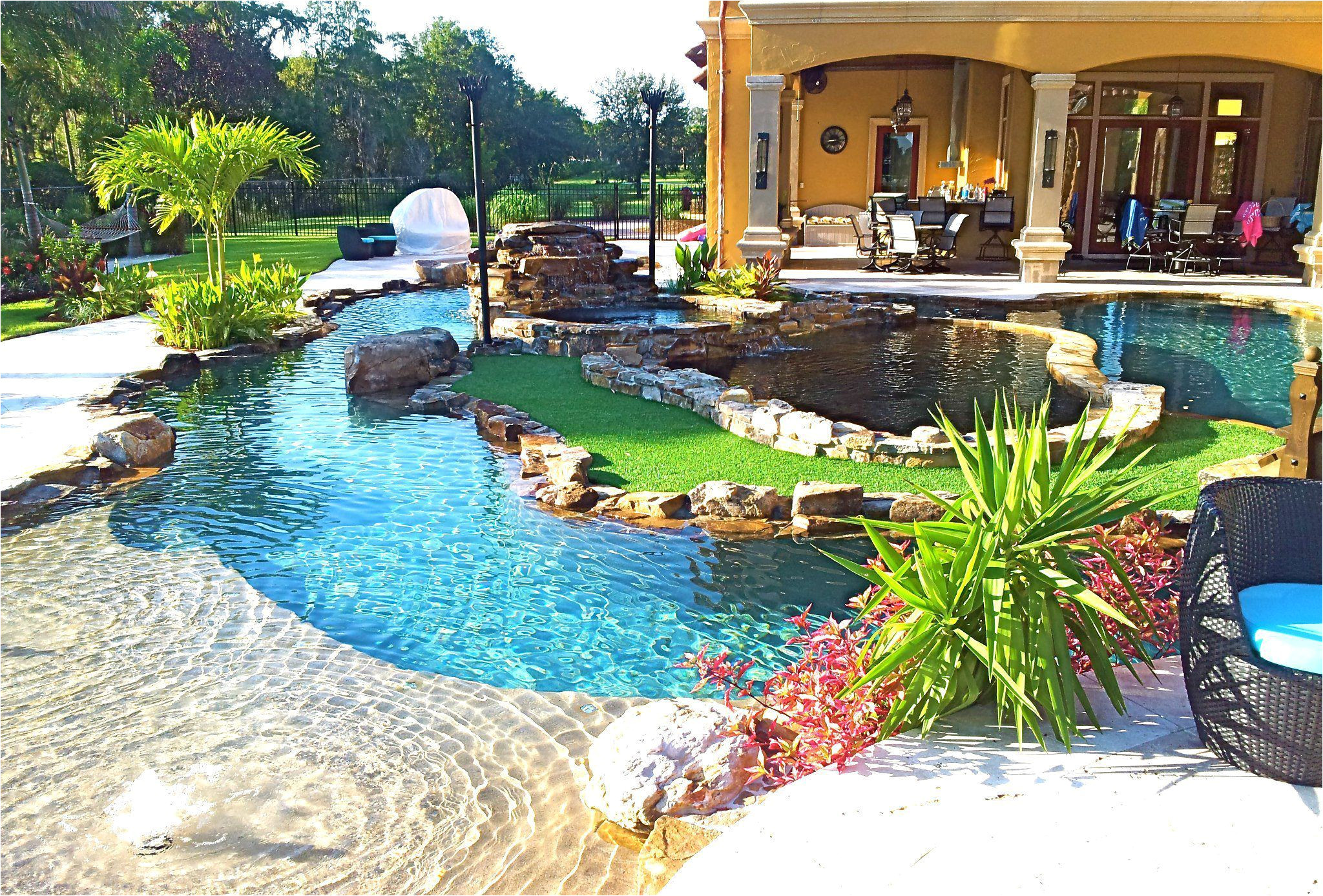 Pools with Blue Surf Pebble Sheen Backyard Oasis Lazy River Pool with island Lagoon and Jacuzzi In the