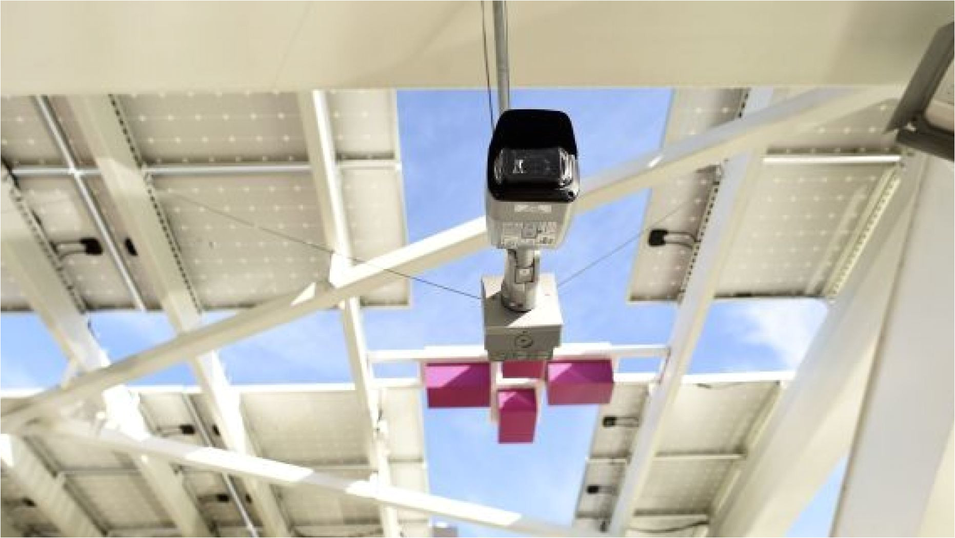 file photo a security camera hangs above a pedestrian bridge used as an entrance to