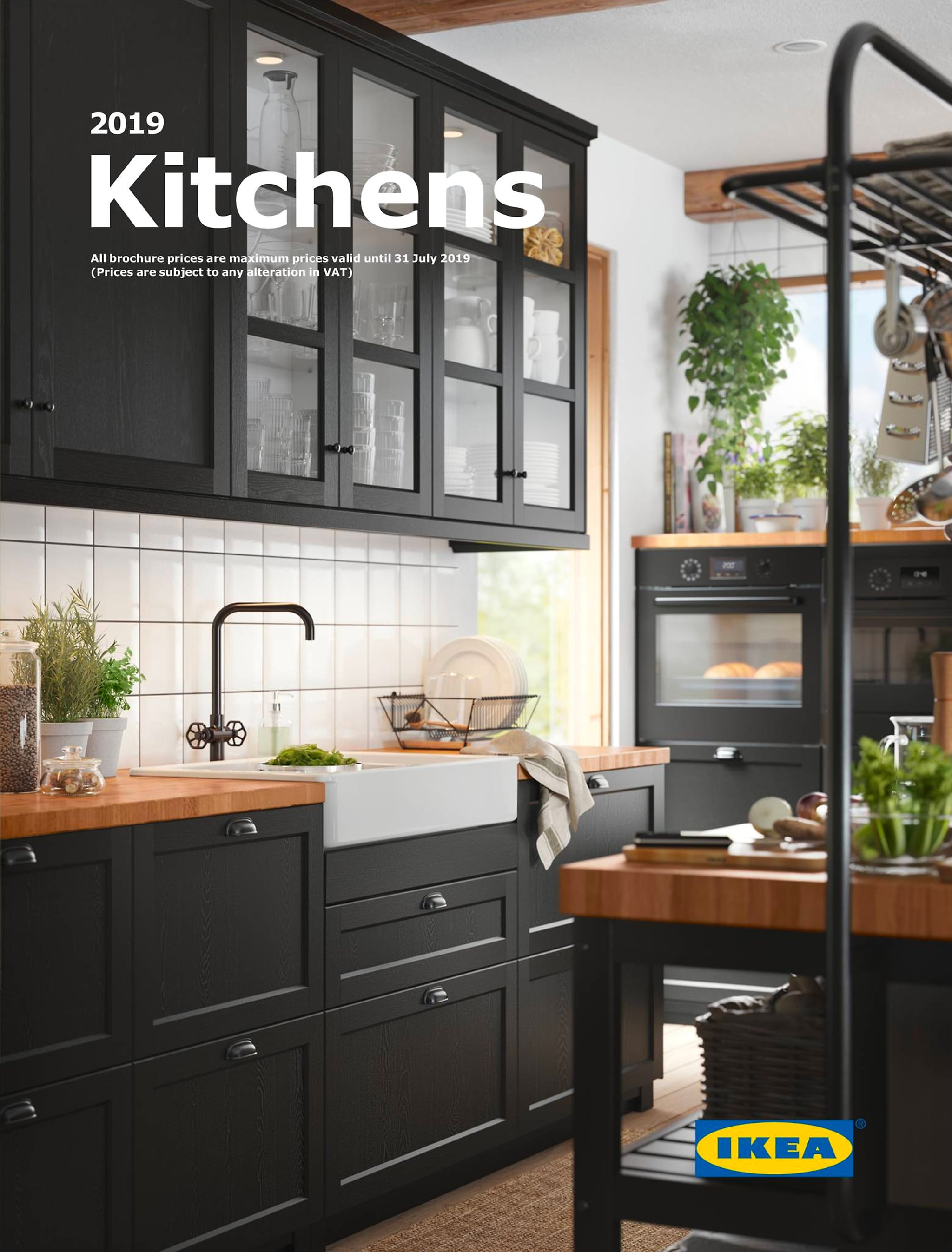 a black traditional kitchen with wooden worktop and a central isle