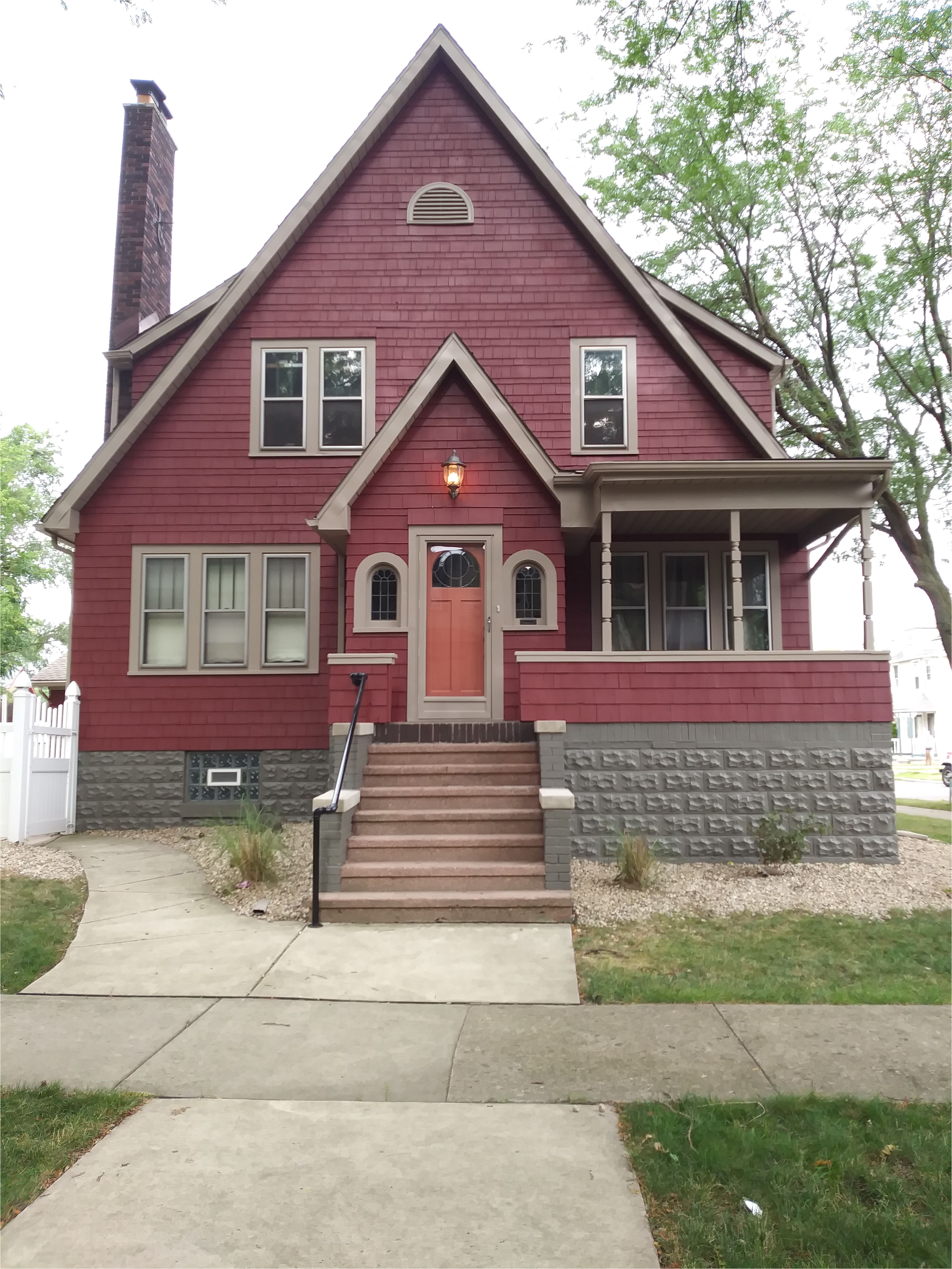 deep red with sycamore tan sherwin williams trim and burnished pewter behr