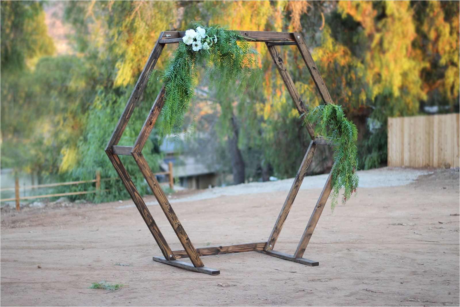 this handmade wood geometric ceremony arch rental item is the perfect accent to any event circle ceremony arch for rent in san diego and southern