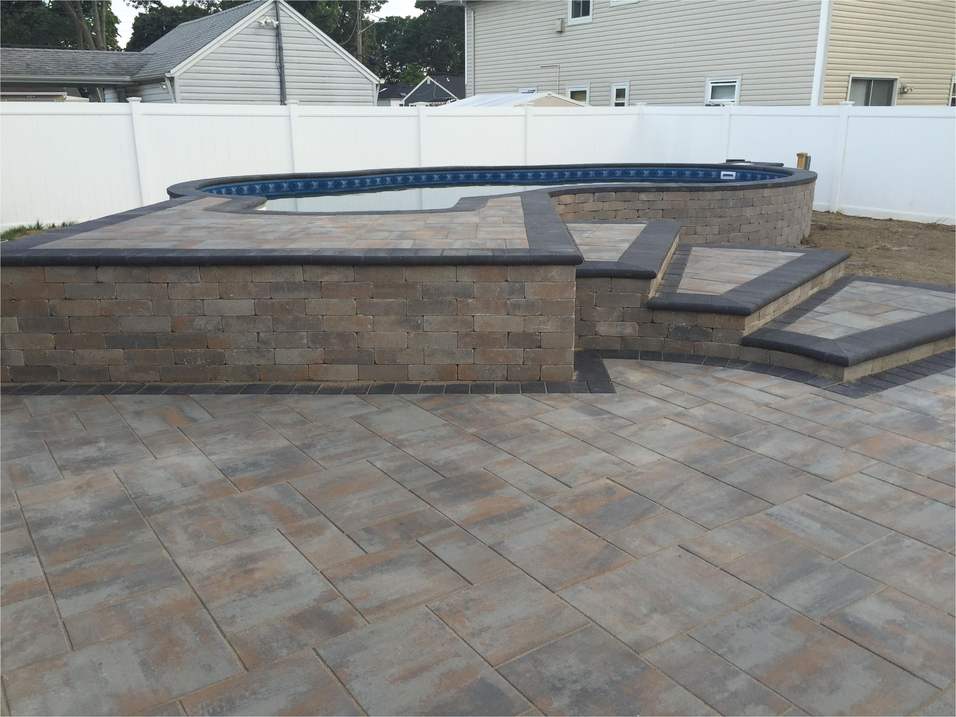 Semi Inground Pools Long island Radiant 16×27 Semi Inground Freeform with Pavers Radiant Pools