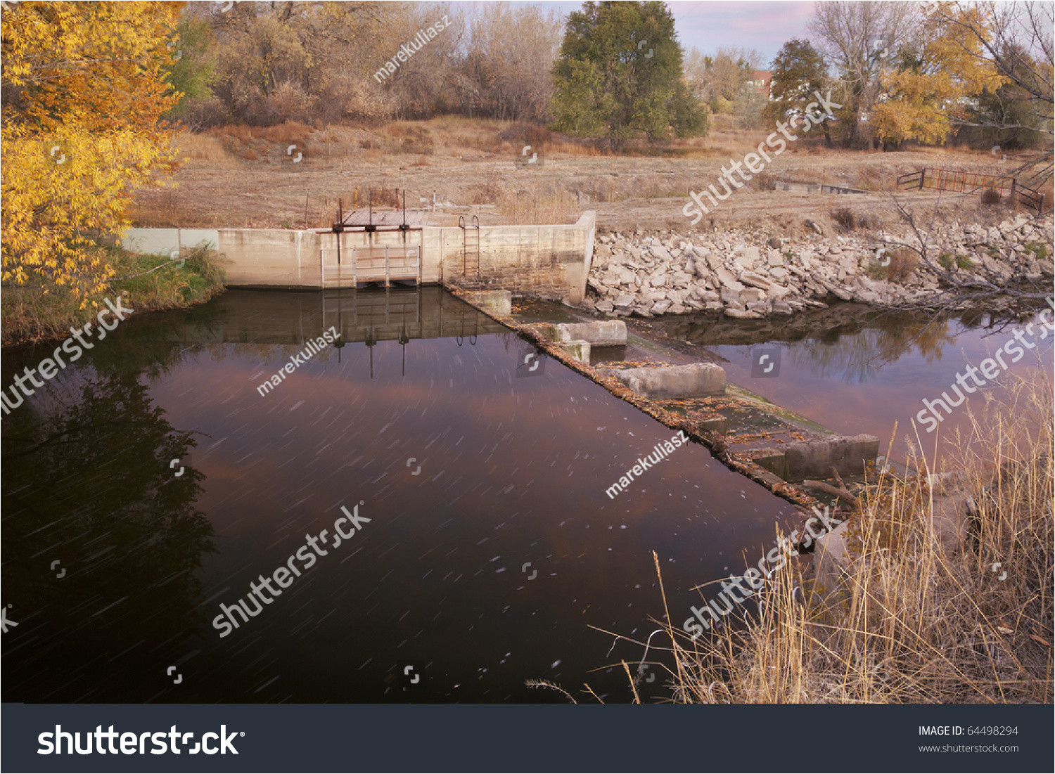 diversion dam with water flowing into irrigation ditch inlet cache la poudre river at fort