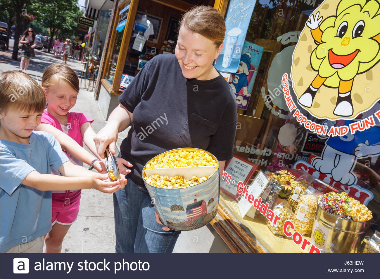 michigan traverse city front street shopping woman girl boy pop kies gourmet popcorn free sample