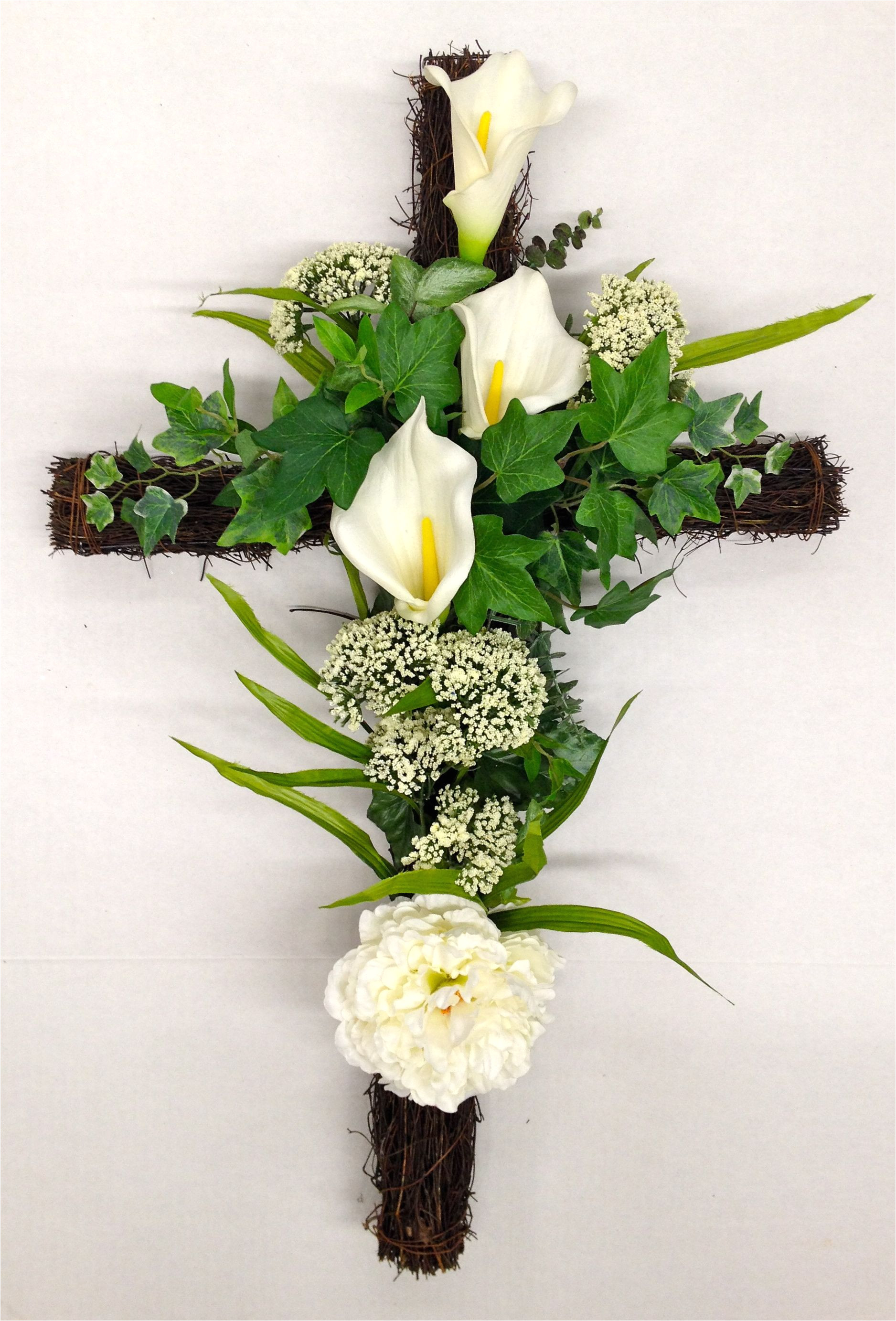 season memorial grape vine cross with white calla lilies and wild powdery white flowering plumes