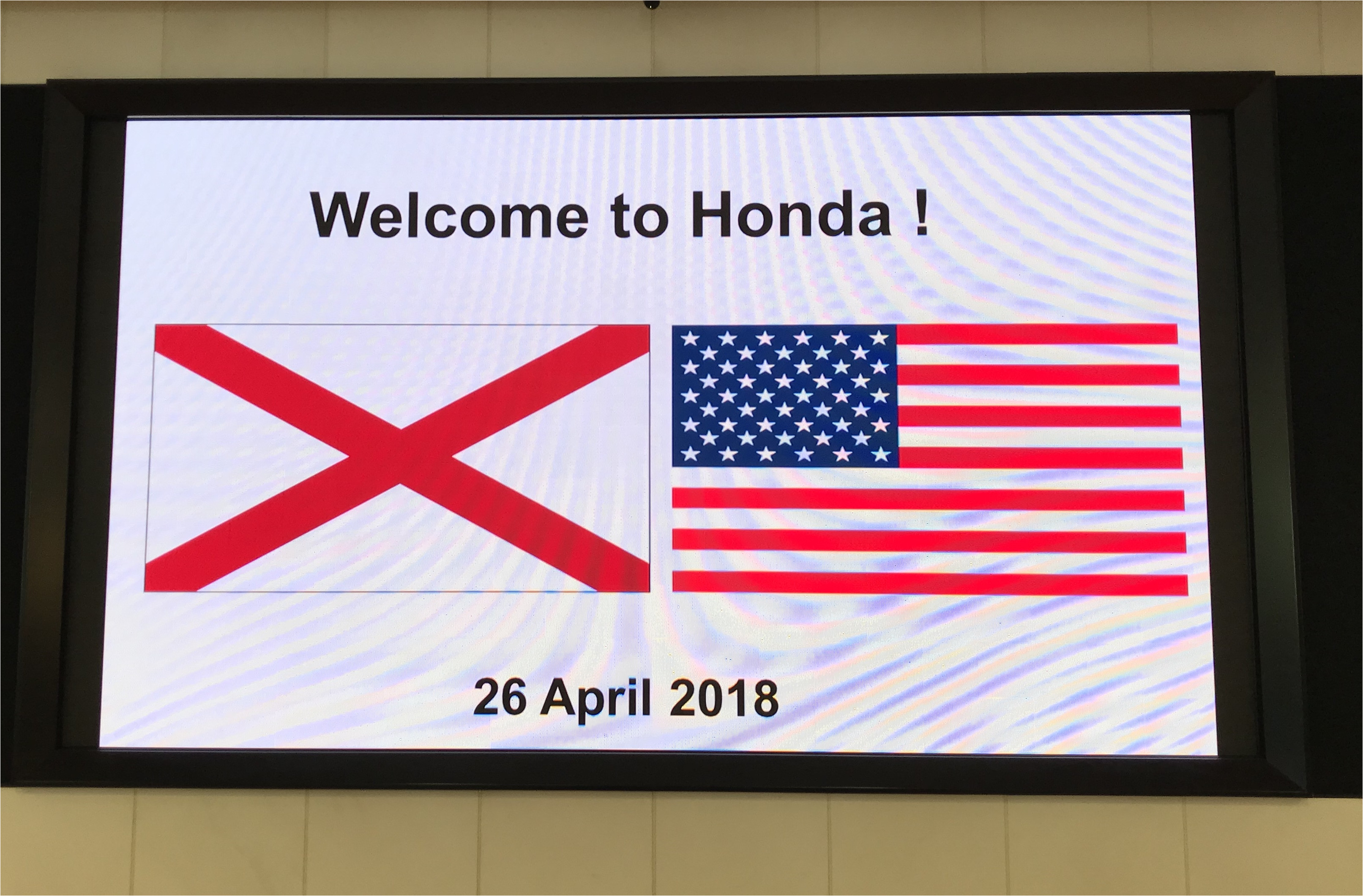 honda greets the alabama team with the alabama and u s flags