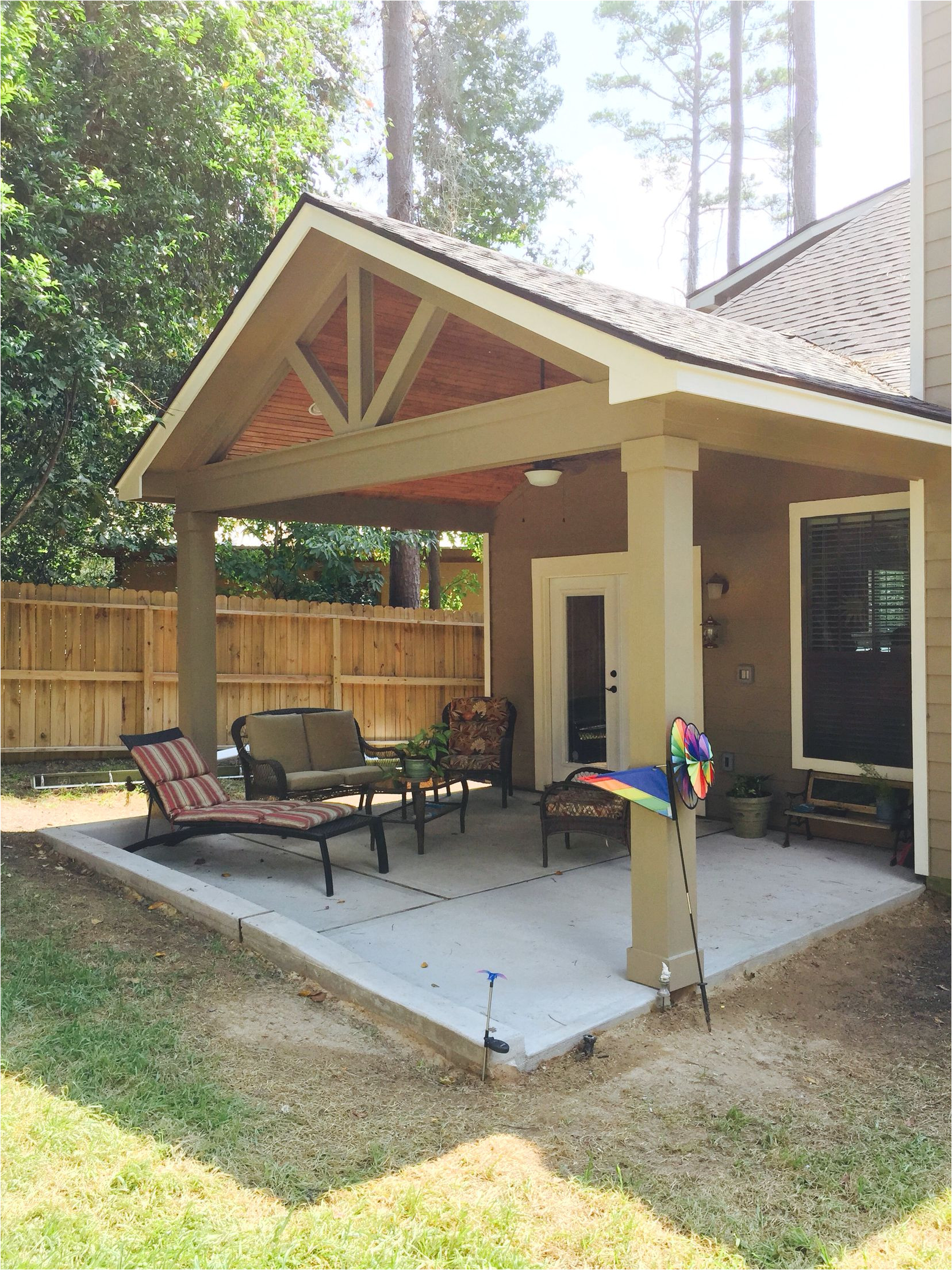 gable roof patio cover with wood stained ceiling